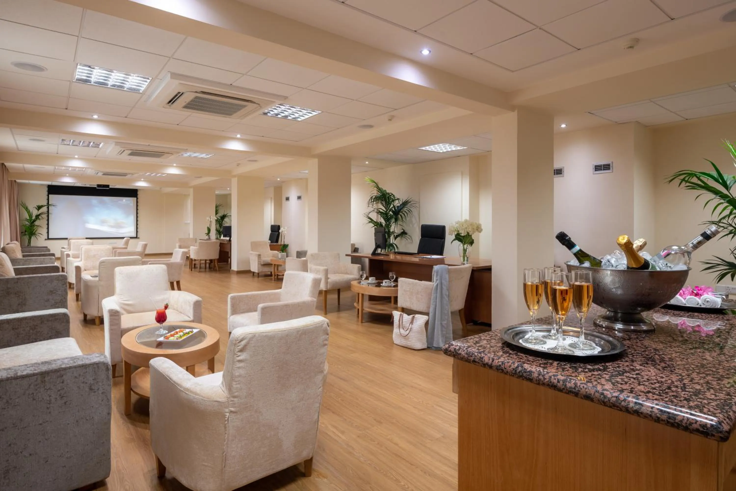 Lounge or bar in Constantinou Bros Athena Beach Hotel