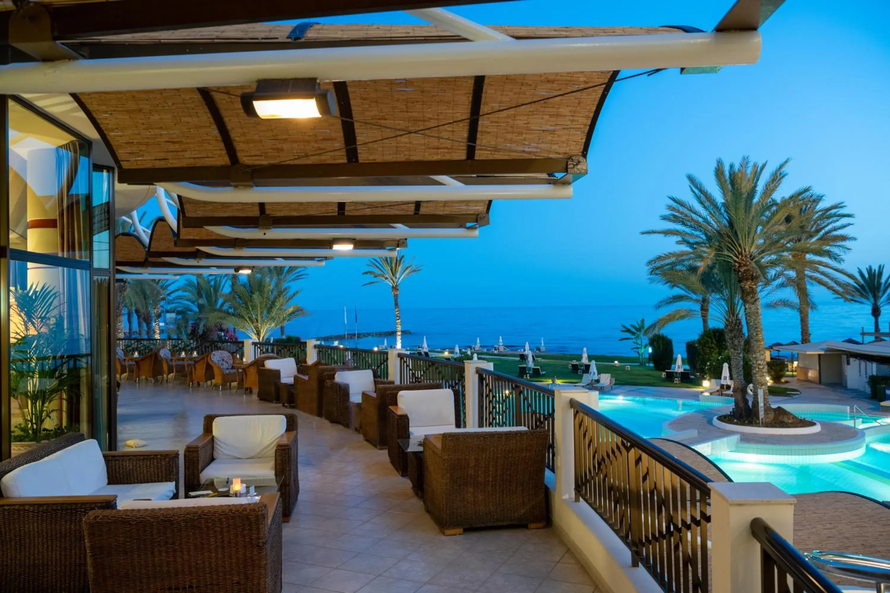 Lounge or bar in Constantinou Bros Athena Beach Hotel Lounge or bar in Constantinou Bros Athena Beach Hotel