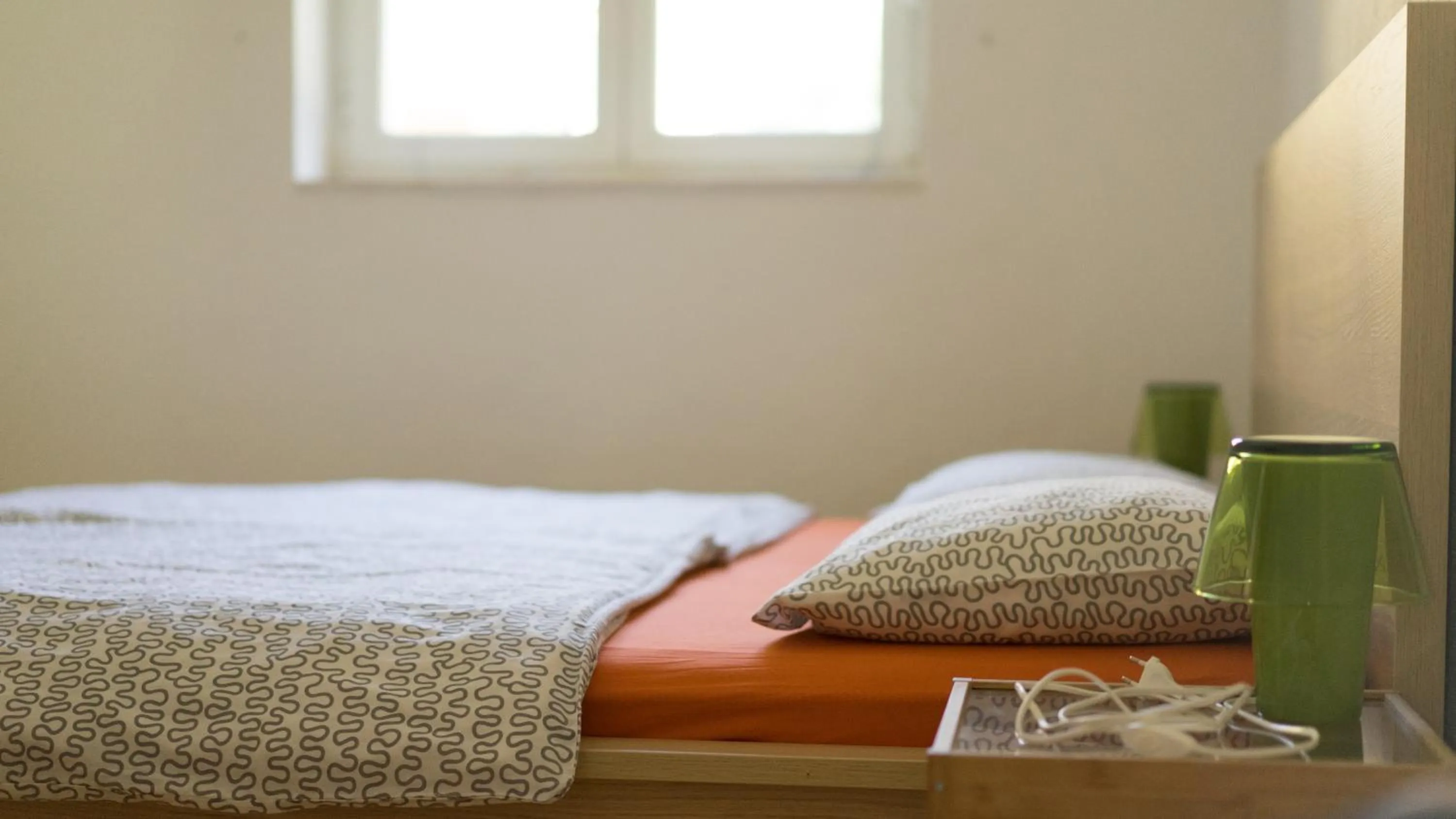 Bed in Apartments Yvonne