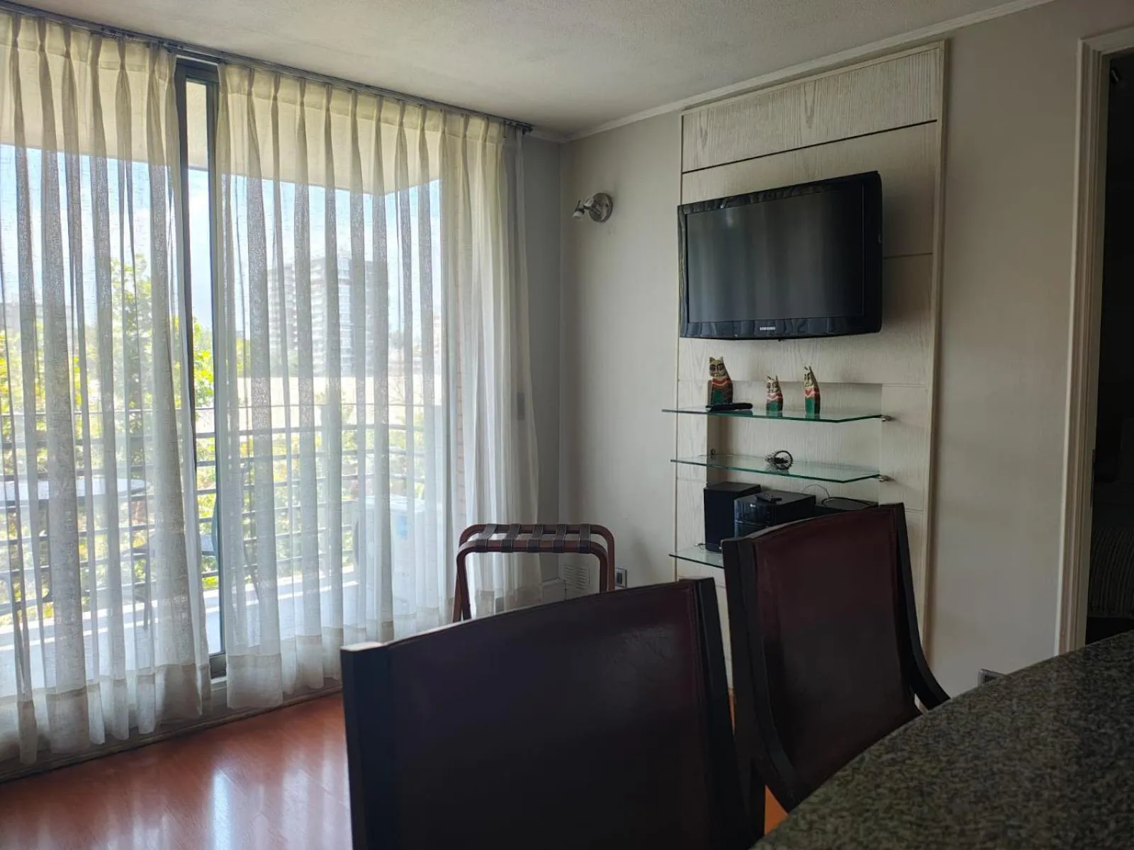 Communal lounge/ TV room in Apart Hotel Cambiaso