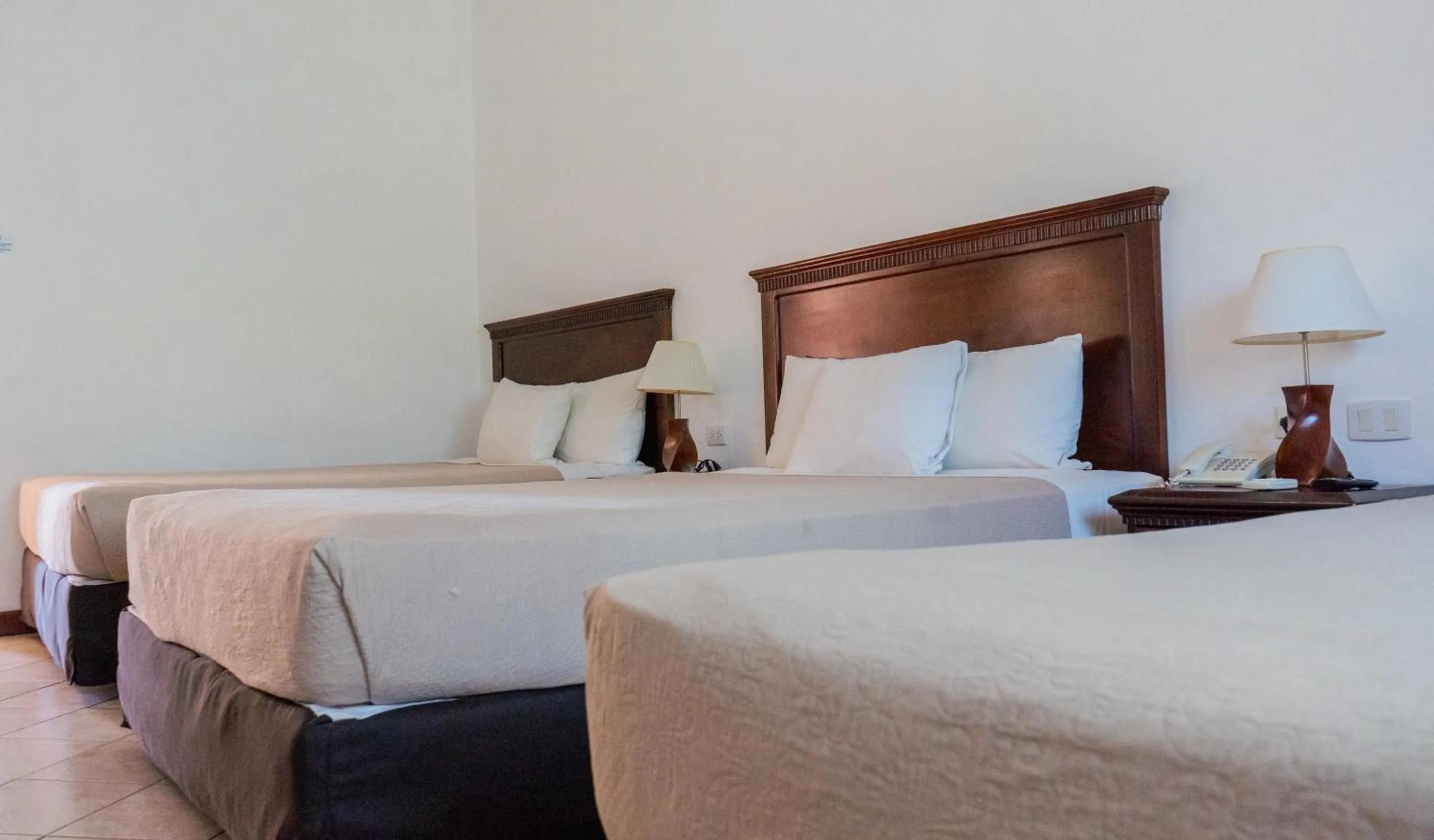 Bed in Hotel Cayman Suites