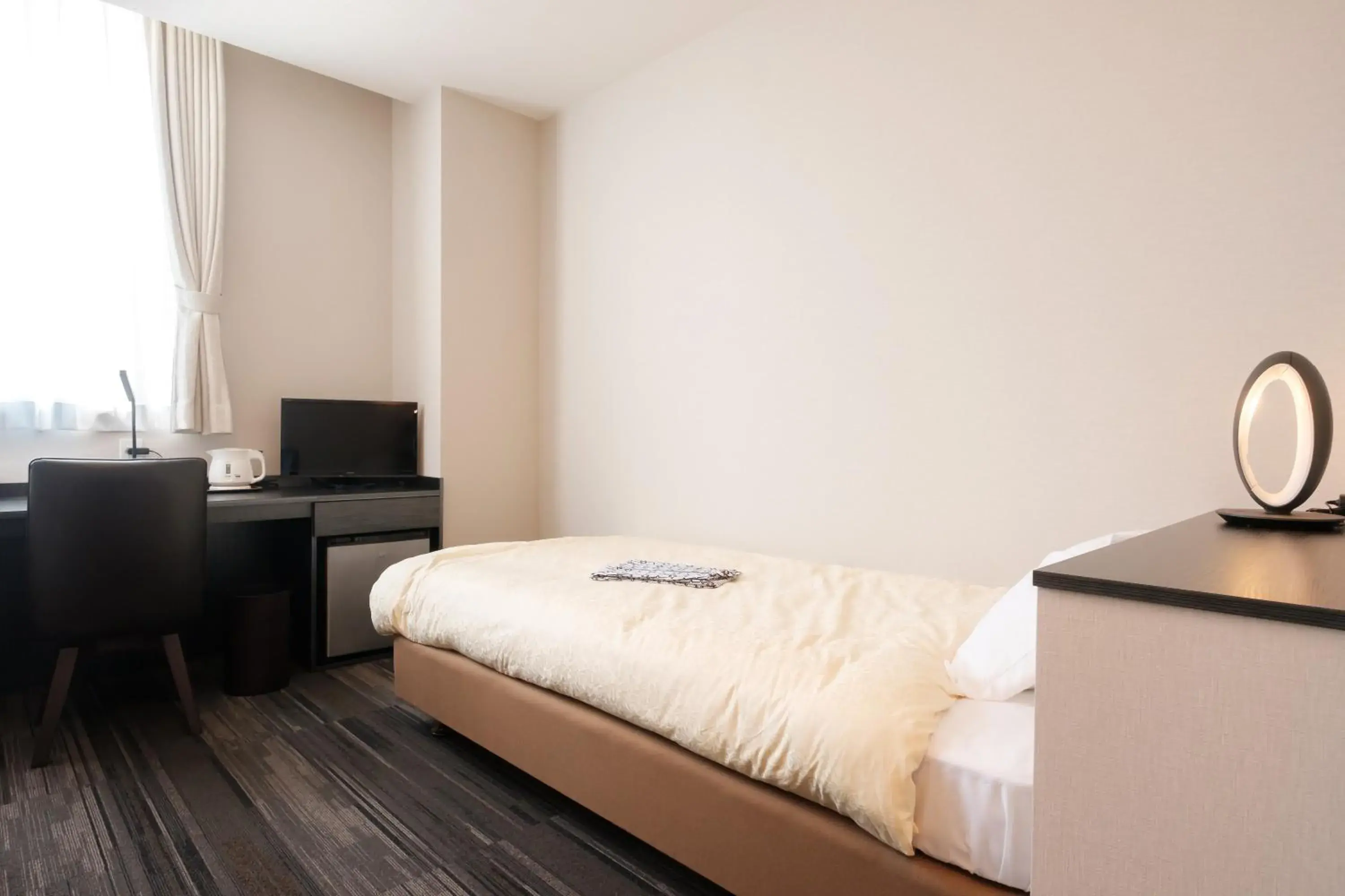 Bed in The Premium Hotel In Rinku Bed in The Premium Hotel In Rinku