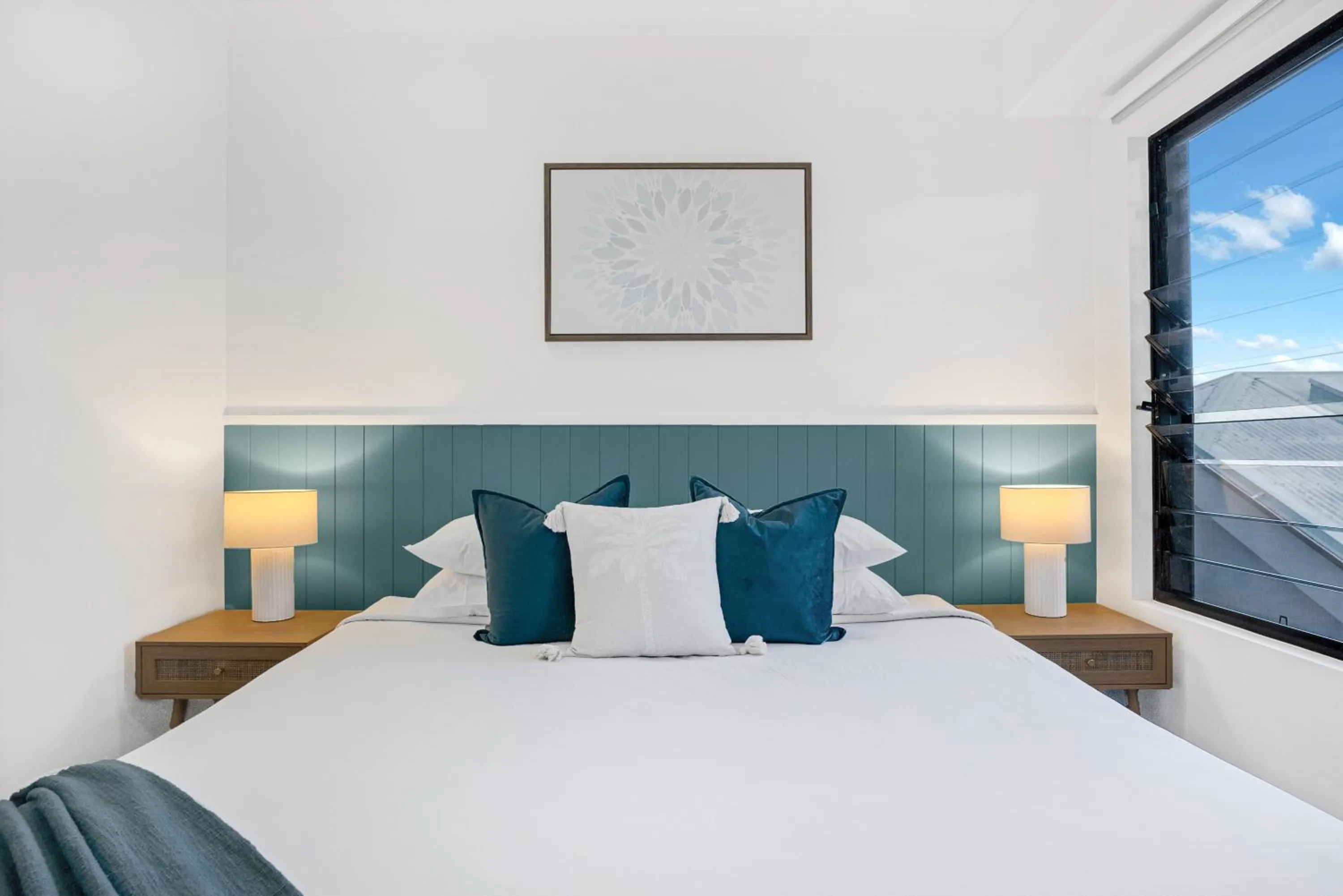 Bed in Elysium Apartments