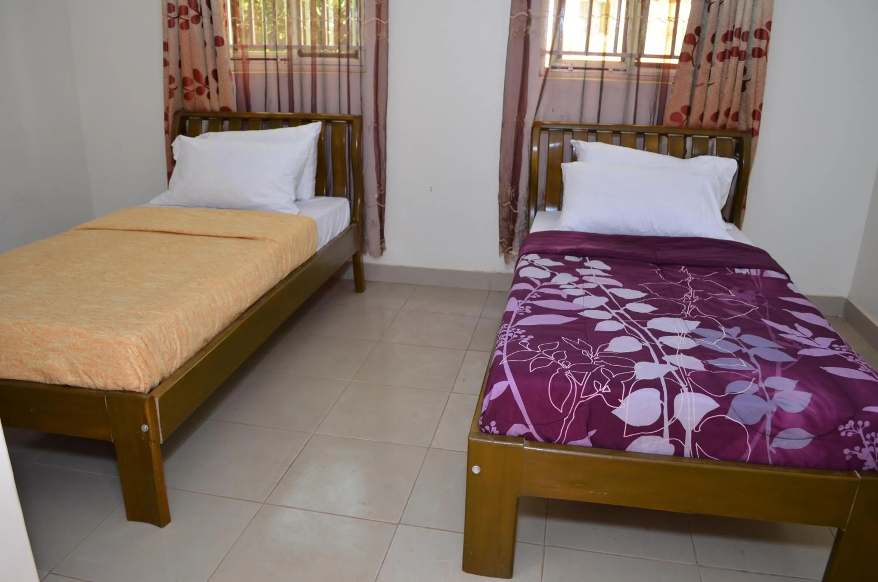 Bed in Sadrina Comfort Cottages Kyanja Kampala