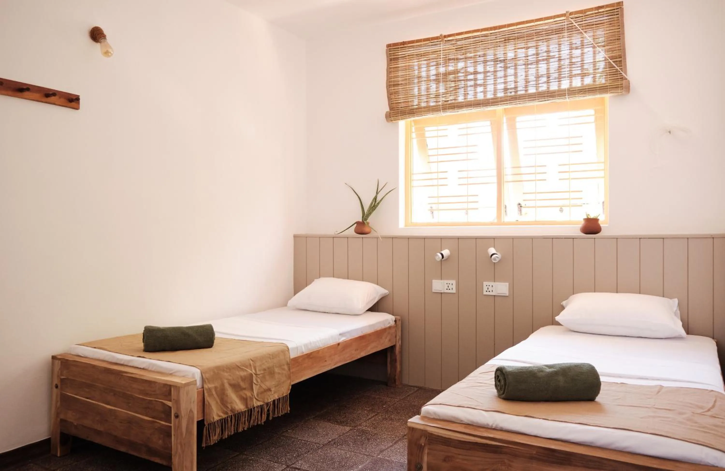 Bed in Basecamp Yoga Beach House
