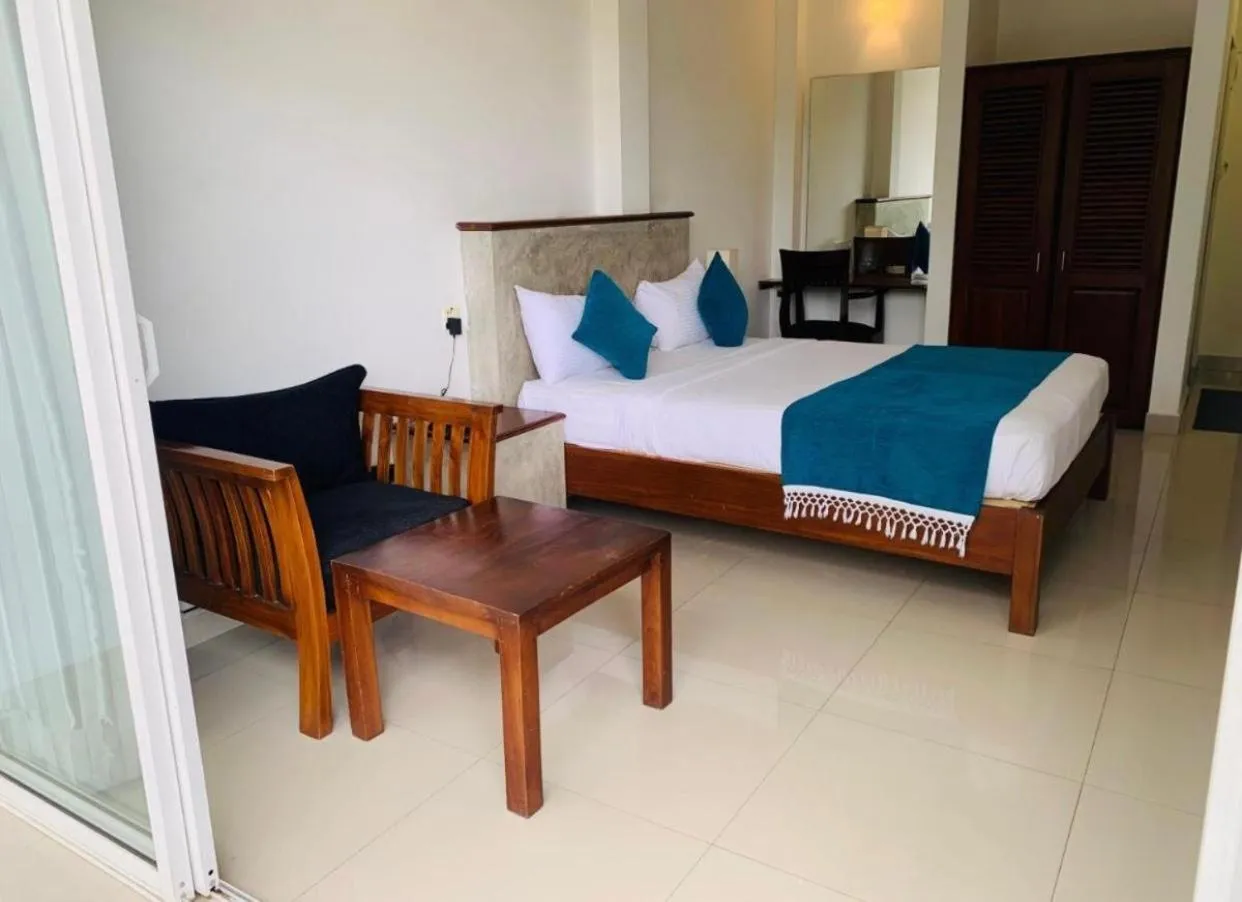 Bed in Hotel Gangaaddara