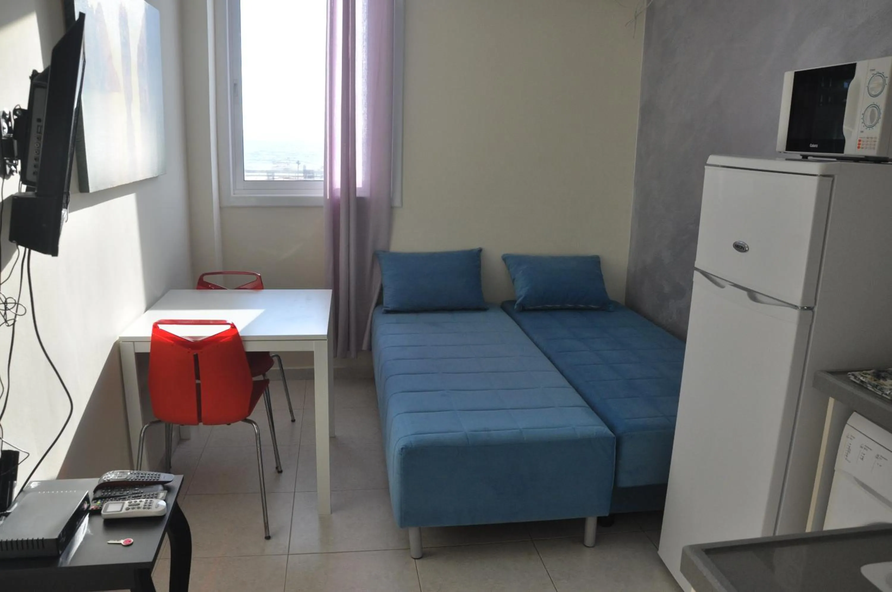 Bed in Beachfront Studio Apartment Bat Yam 412
