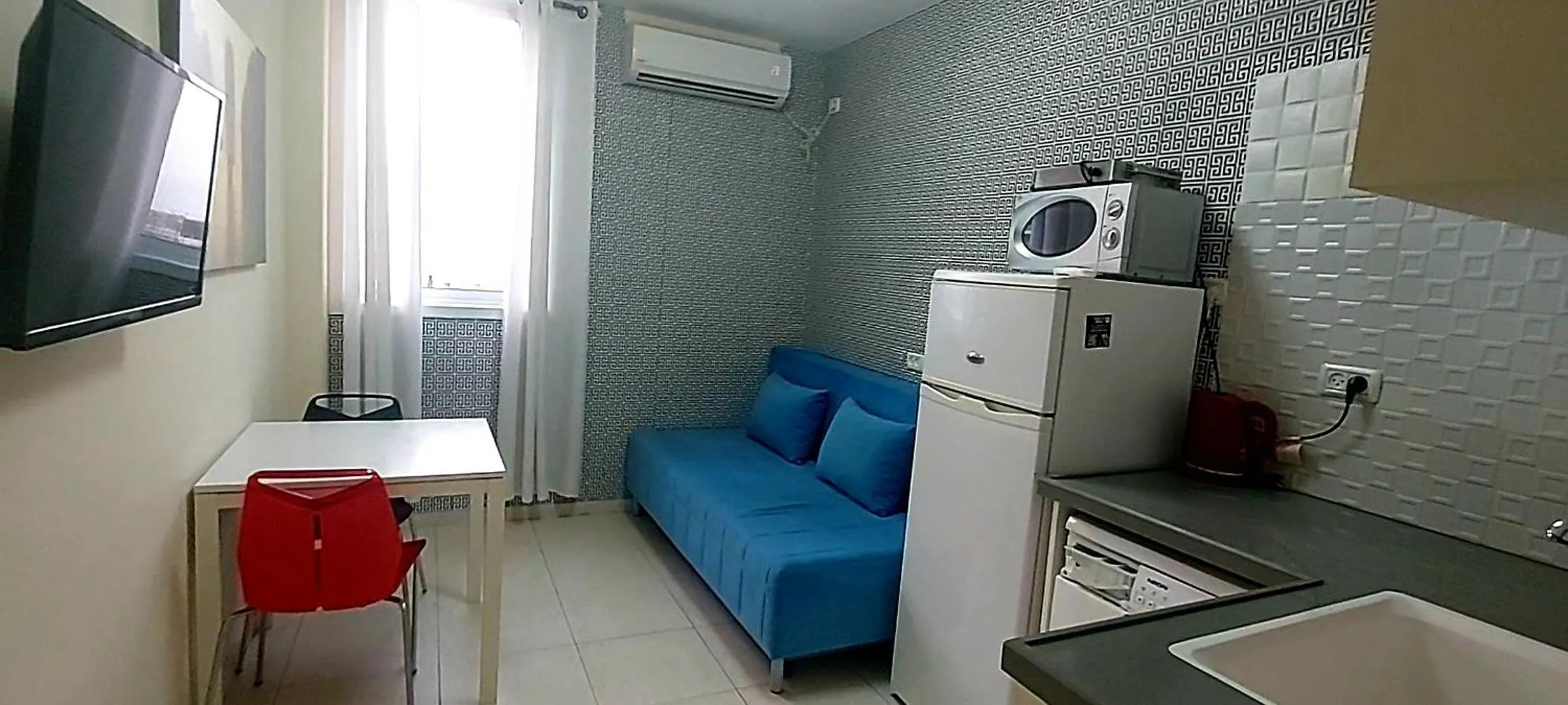 TV and multimedia in Beachfront Studio Apartment Bat Yam 412