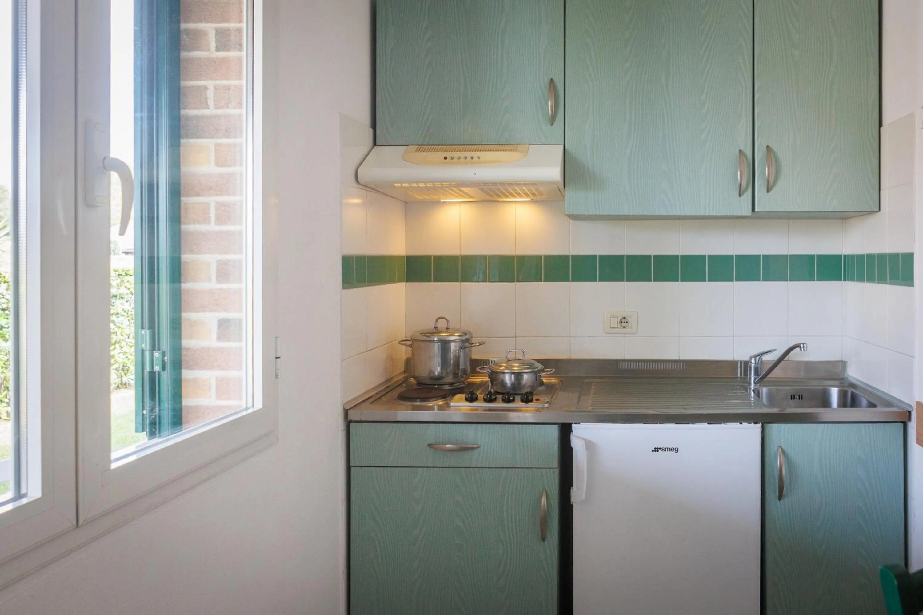 Kitchen or kitchenette in Villaggio Turistico La Cecinella