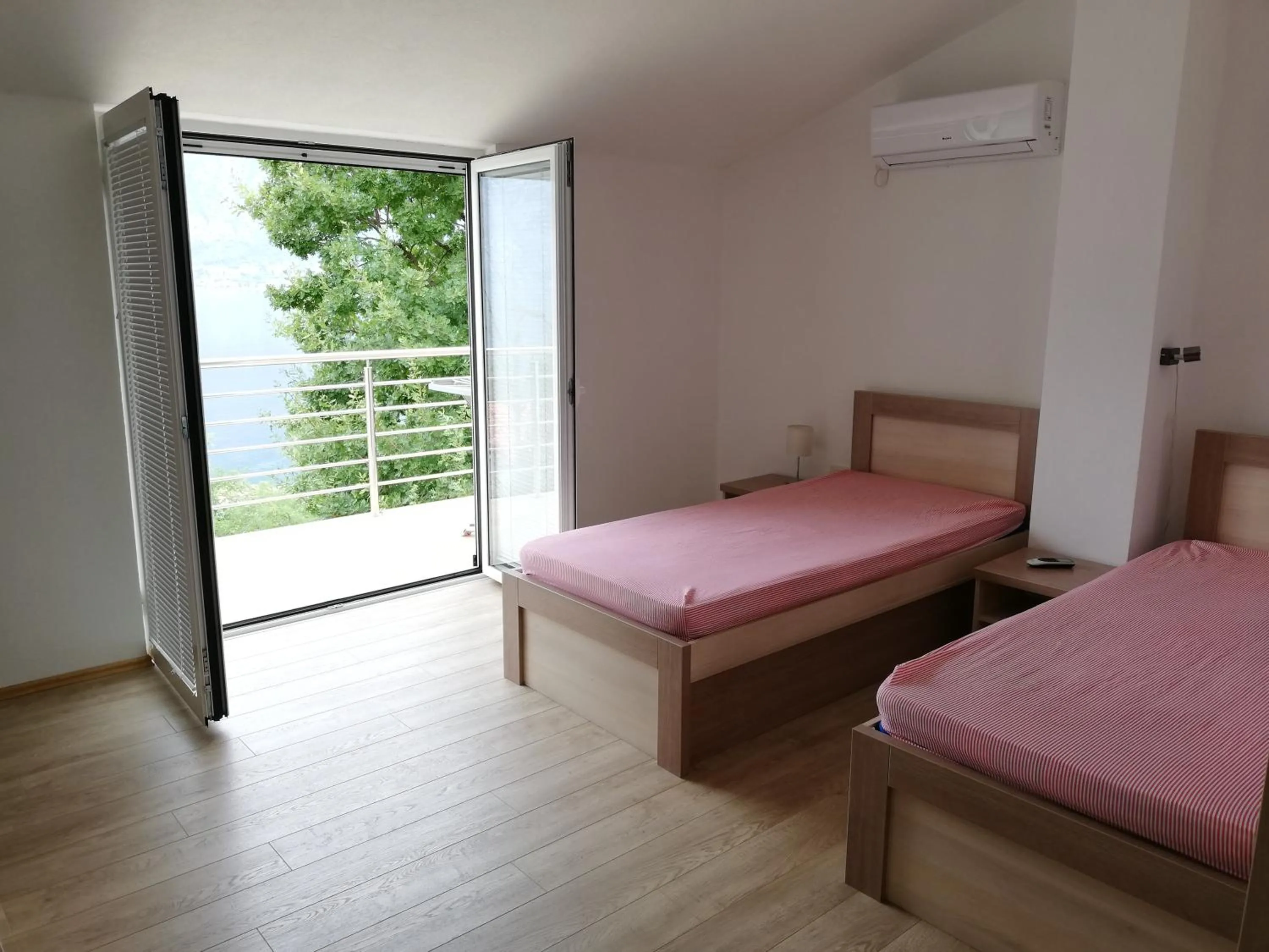 Bed in Ruža Apartments Sea View