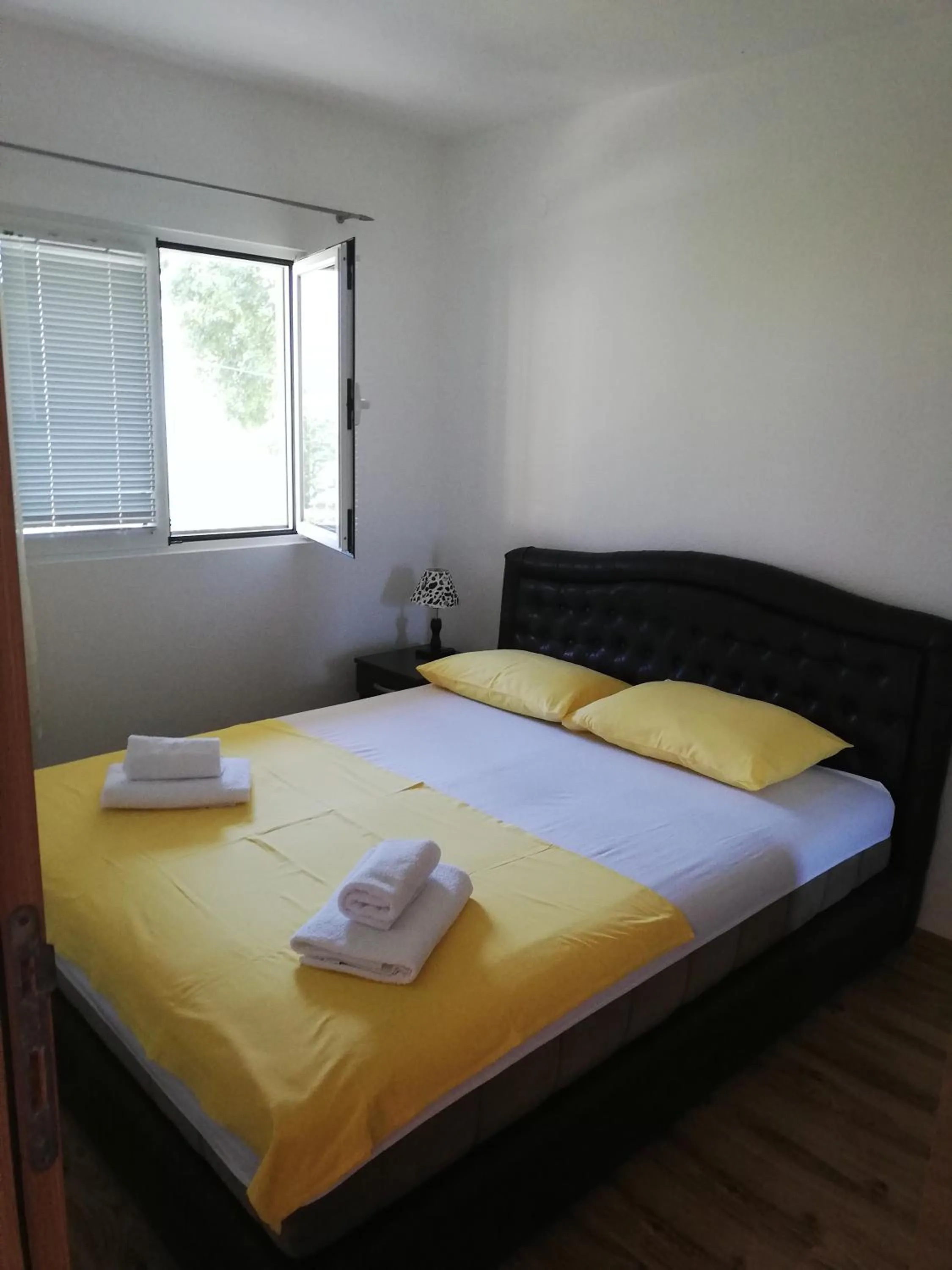 Bed in Ruža Apartments Sea View