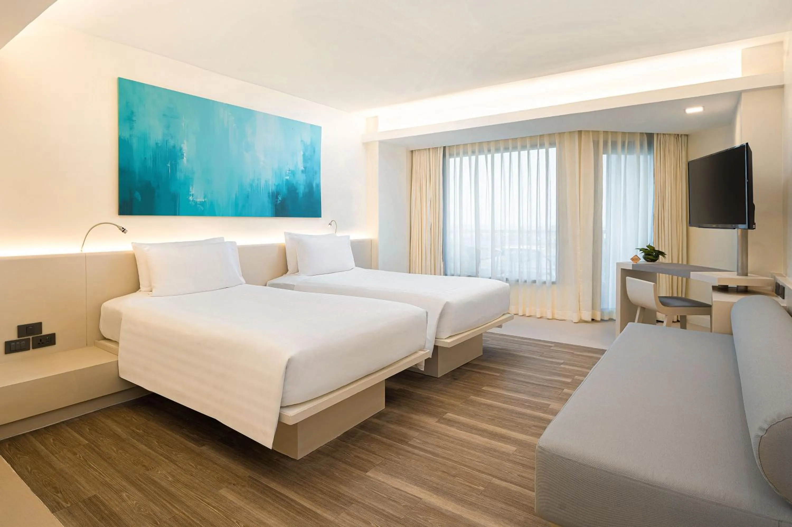 Bed in Pullman Pattaya Hotel G