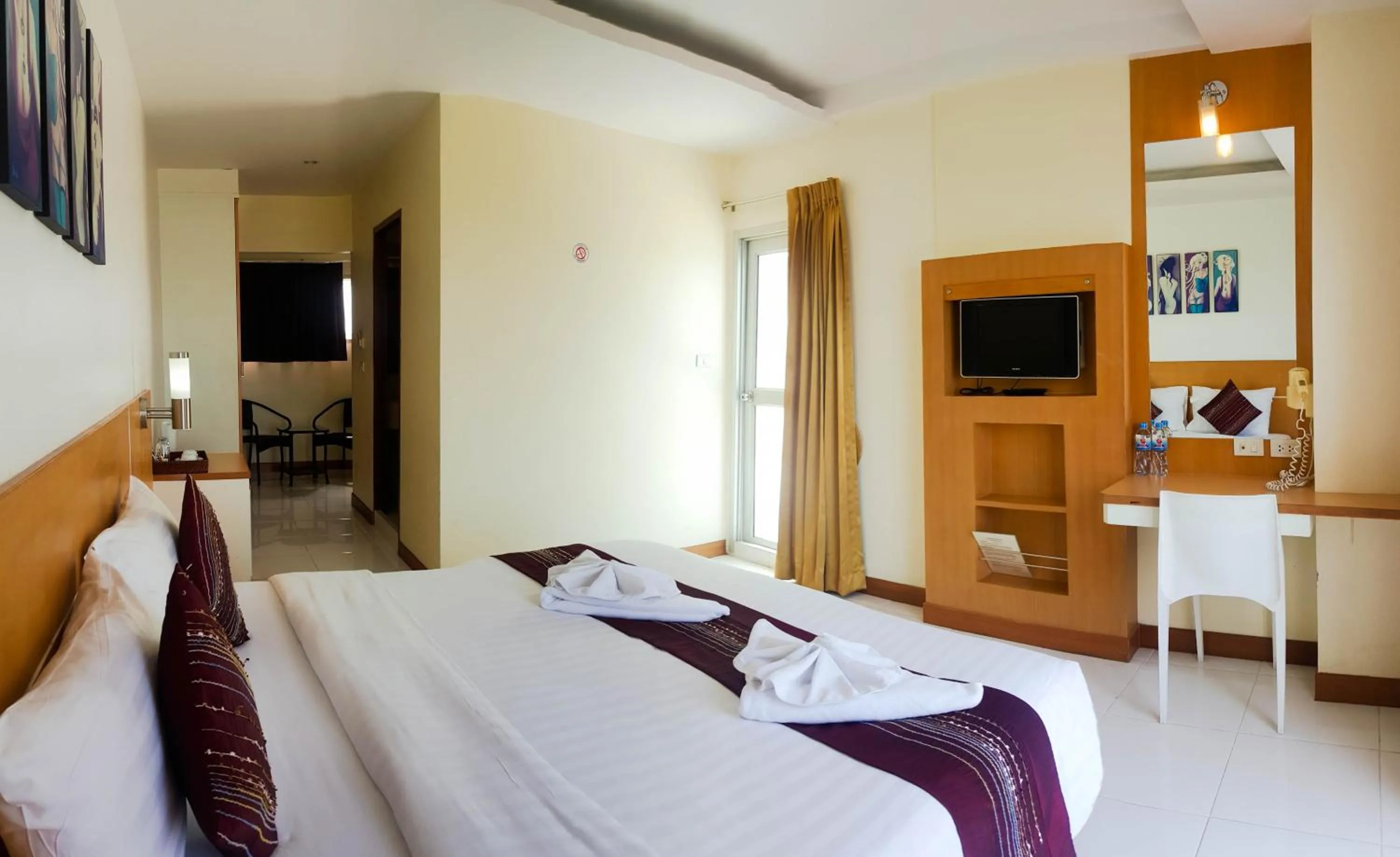 Bed in Eastiny Seven Hotel