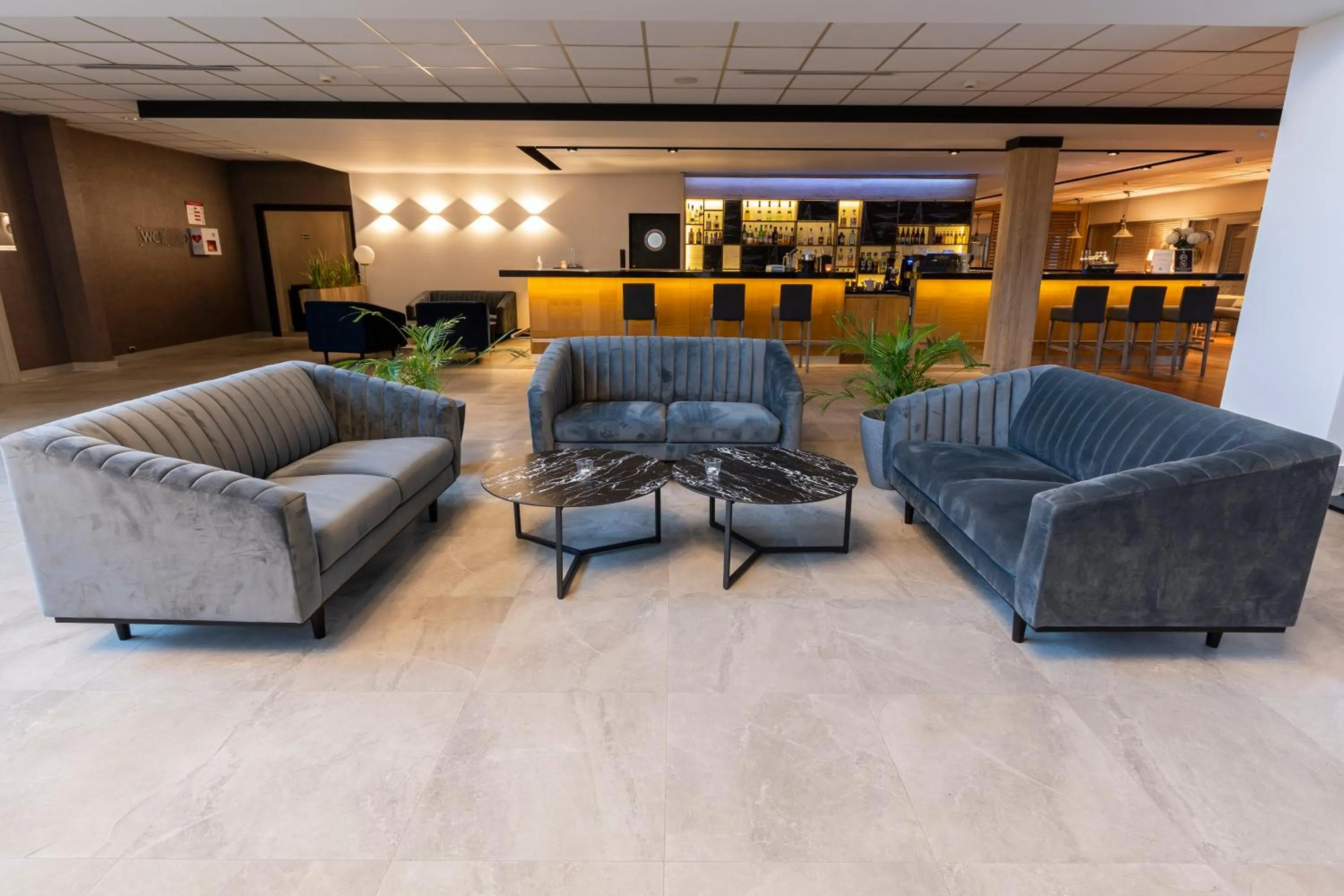 Lobby or reception in Omega Hotel