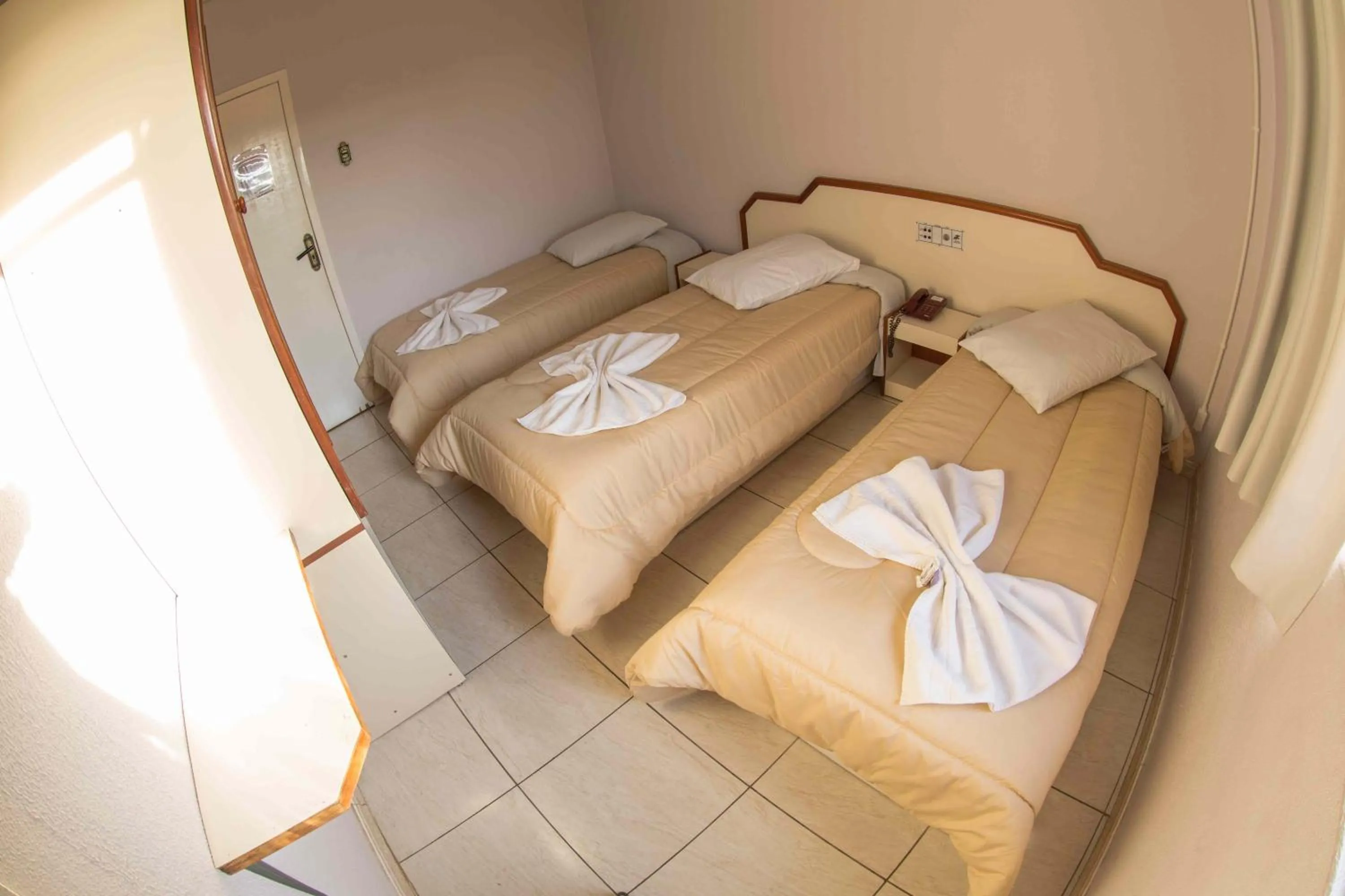 Bed in Hotel Tubarao