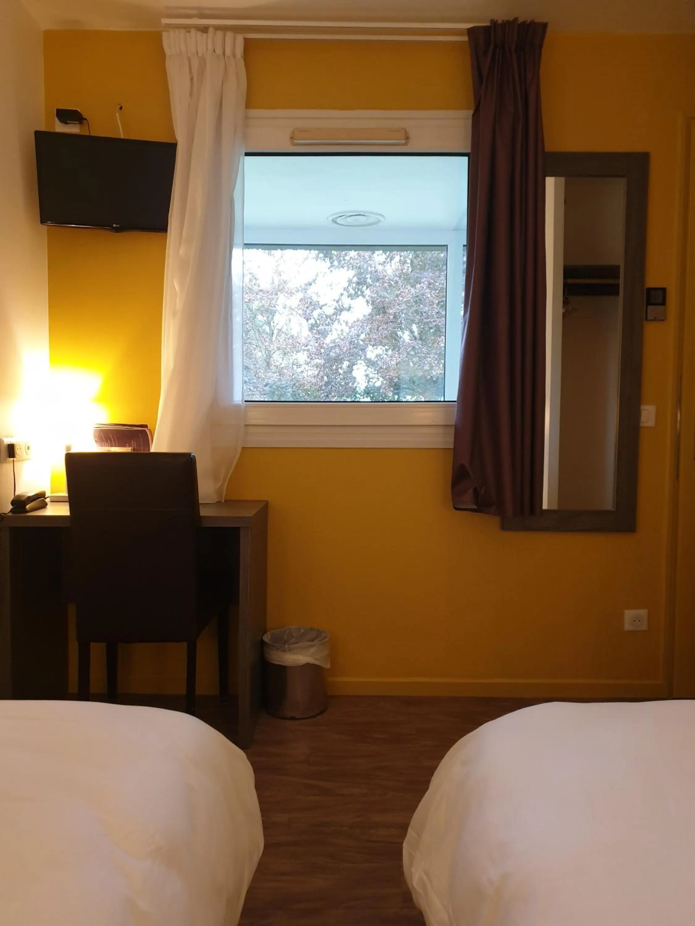 Photo of the whole room, Bed in Logis Hotel des Portes de Meuse