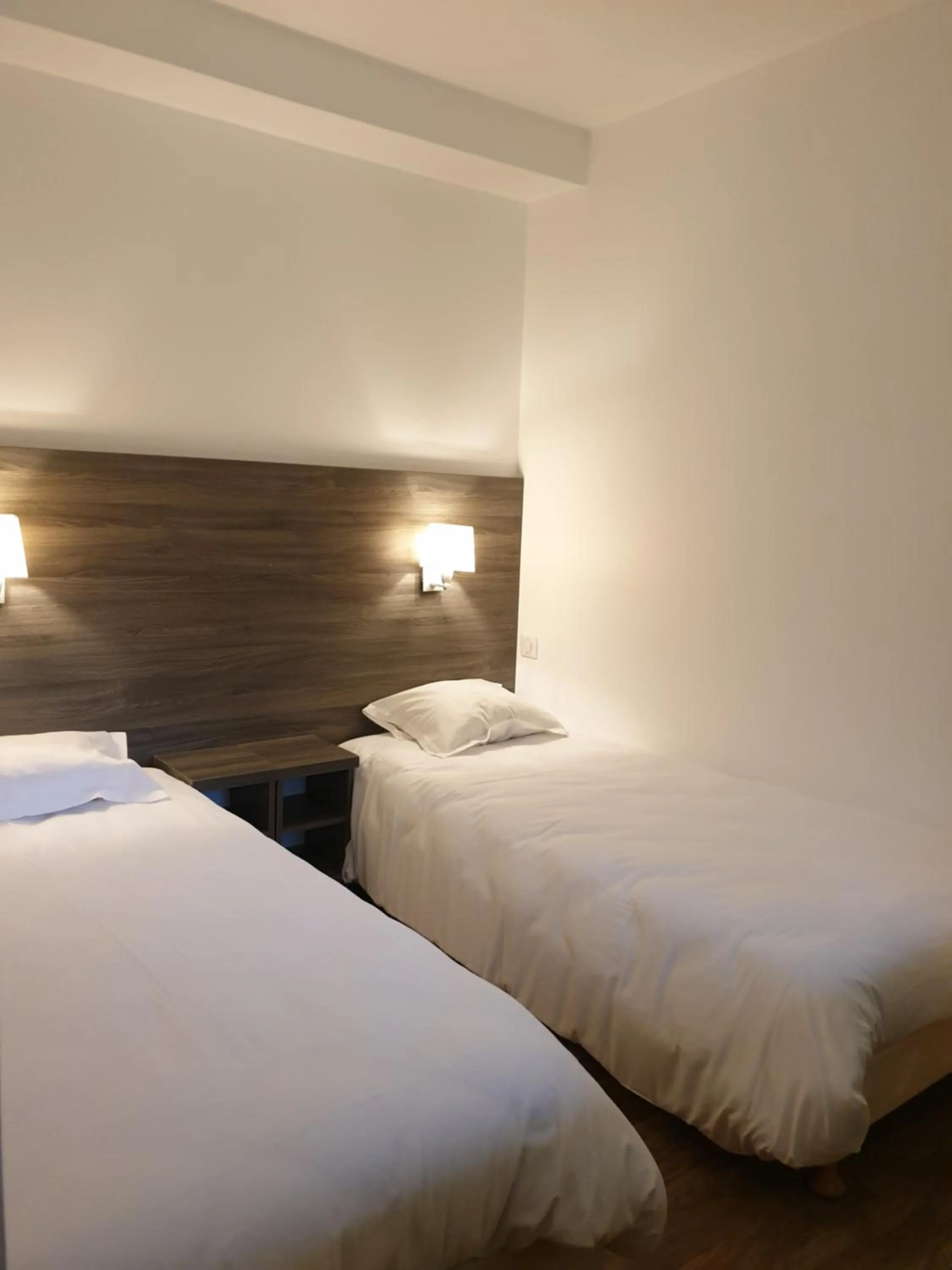 Bed in Logis Hotel des Portes de Meuse