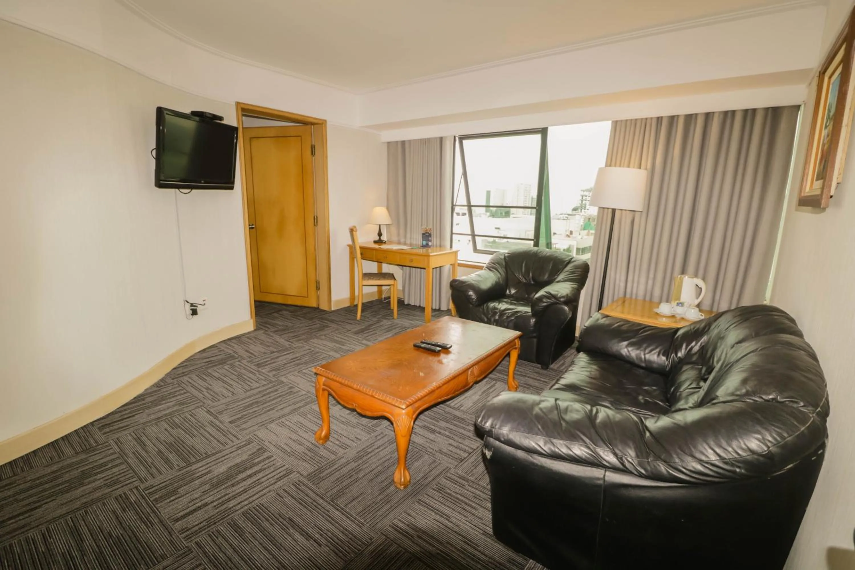 Communal lounge/ TV room in Hotel Miramar