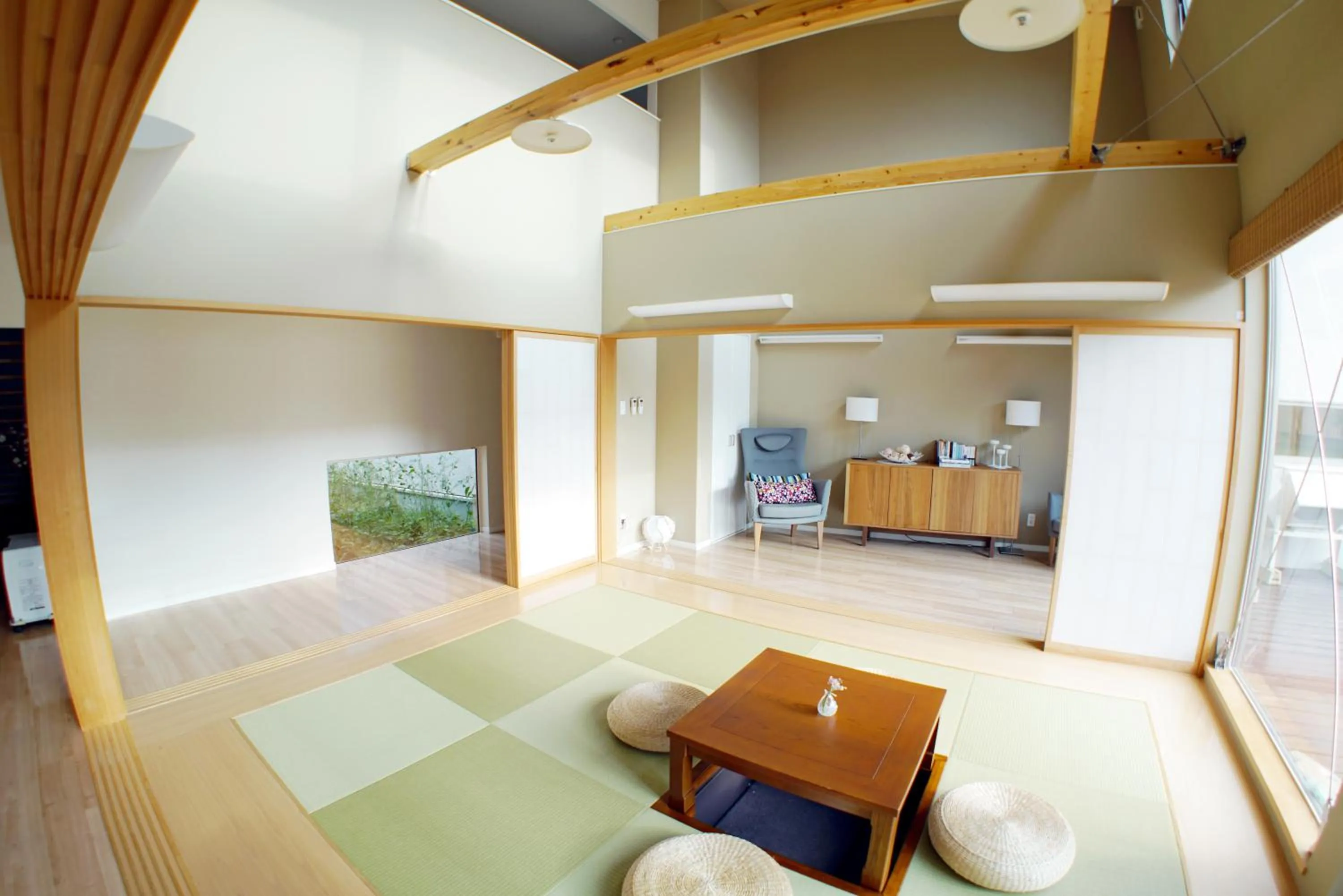 Living room, Bed in Villa Sapporo Honobono