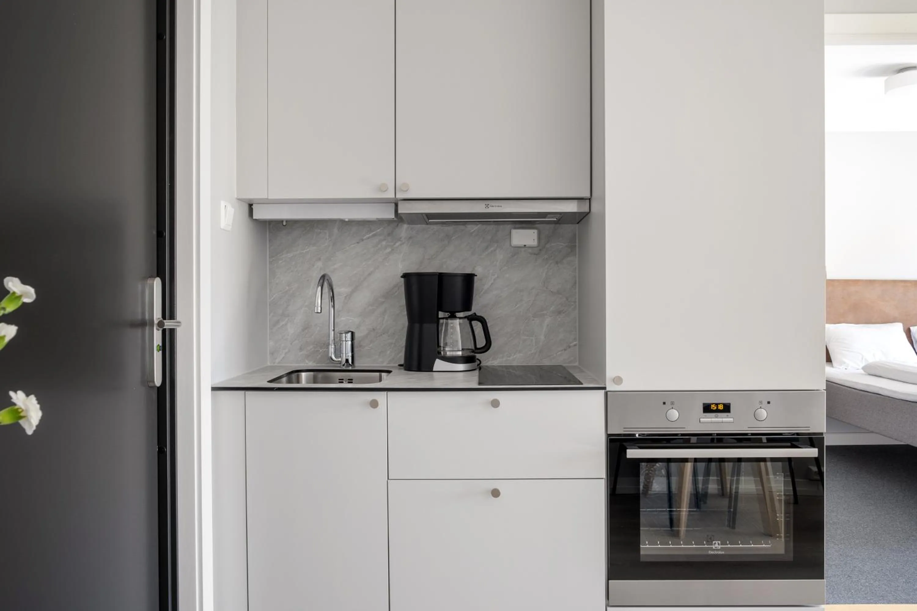 Kitchen or kitchenette, Bed in Bjørvika Apartments - Sirkus Renaa