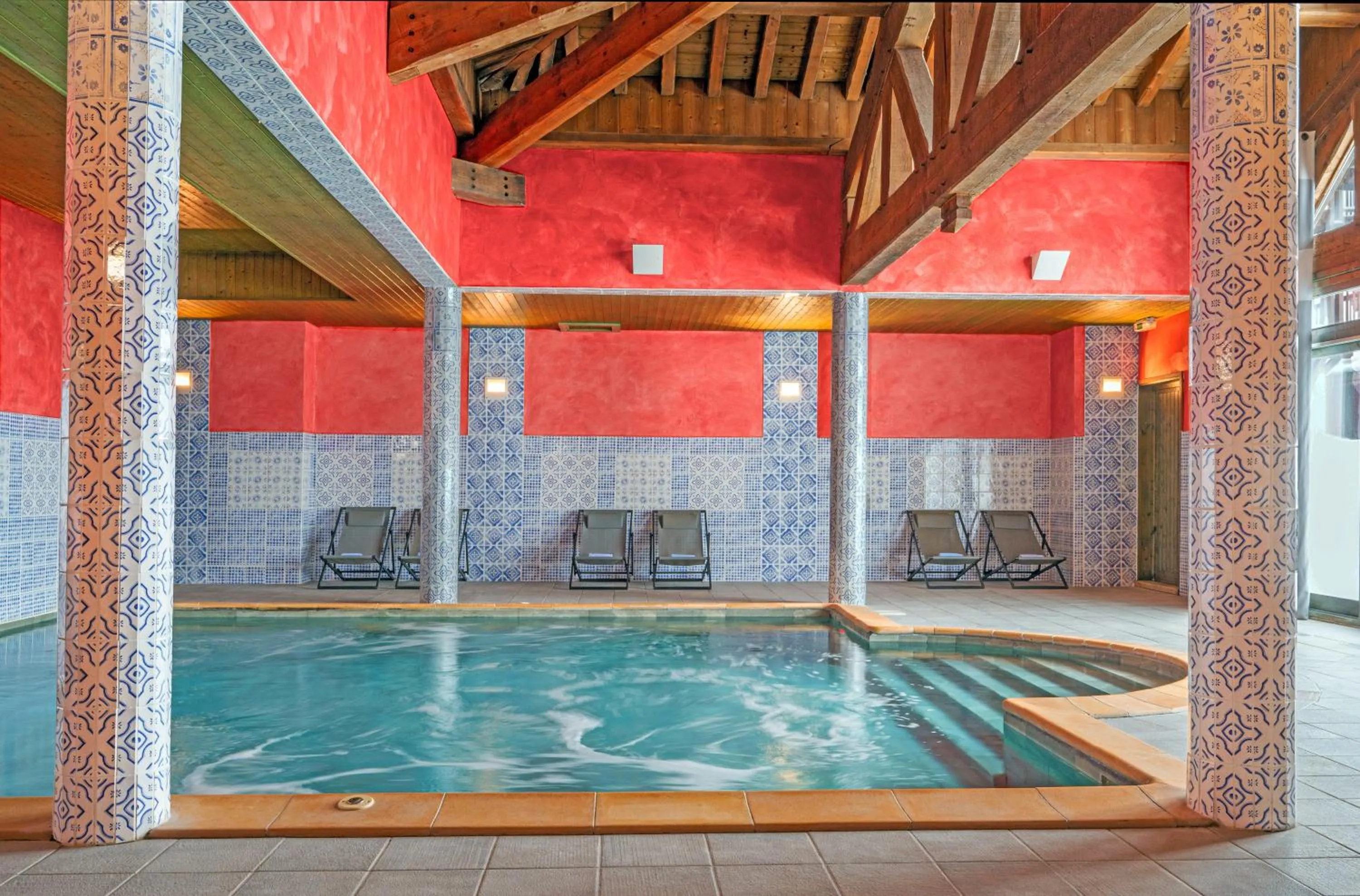 Swimming pool in Hôtel Les Suites du Montana by Les Etincelles