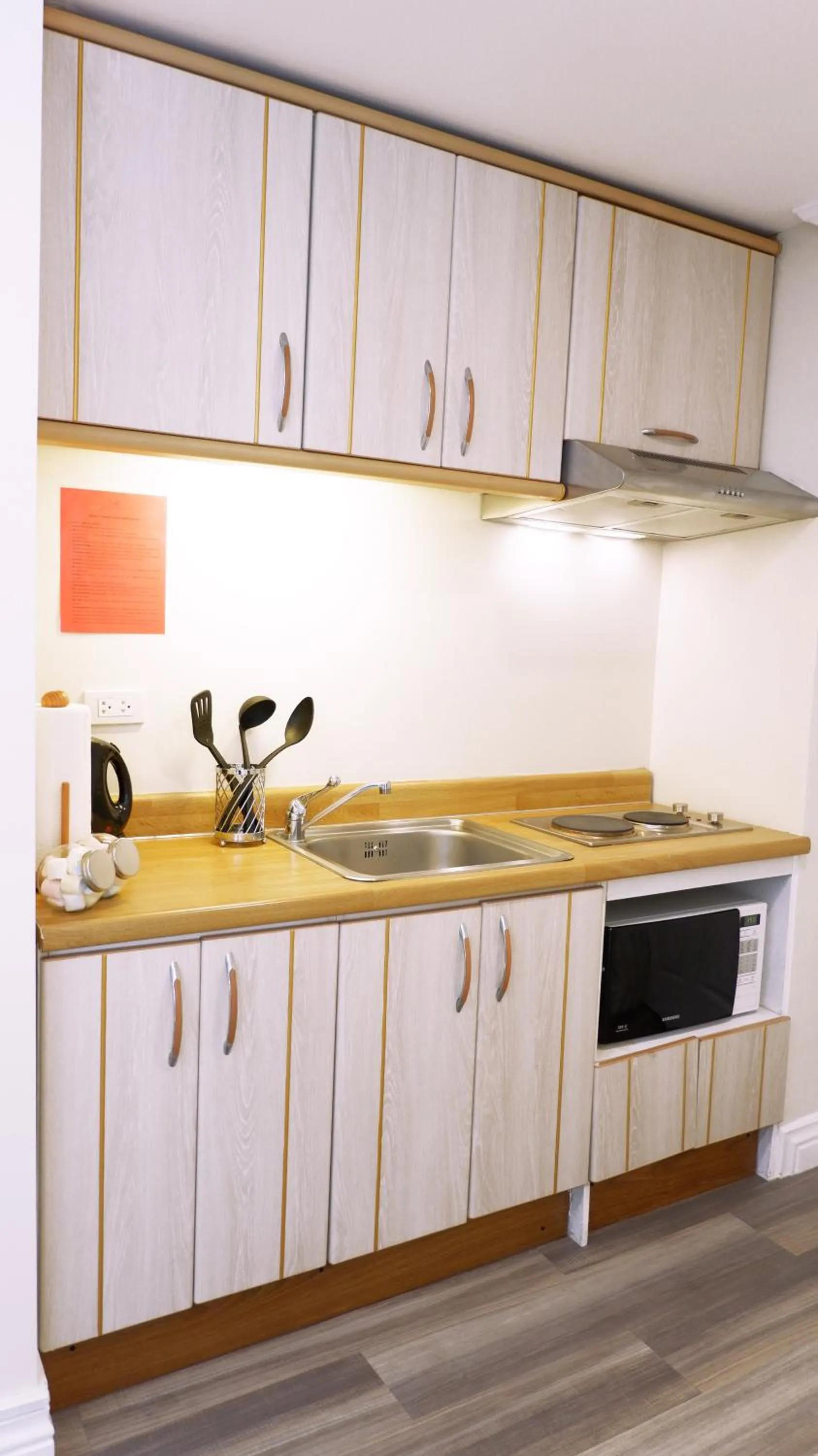 Kitchen or kitchenette in Infinity Tower Suites