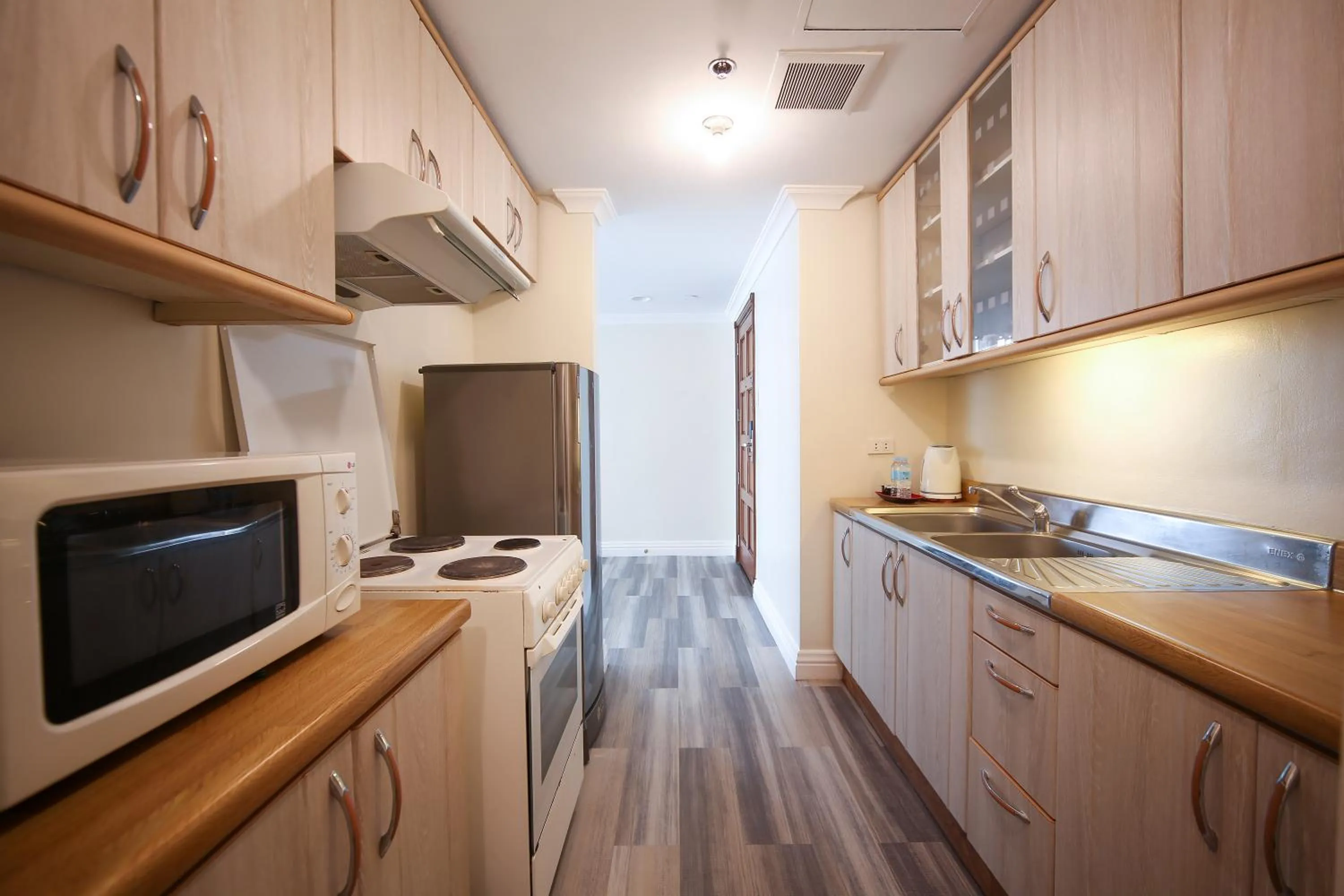 Kitchen or kitchenette in Infinity Tower Suites