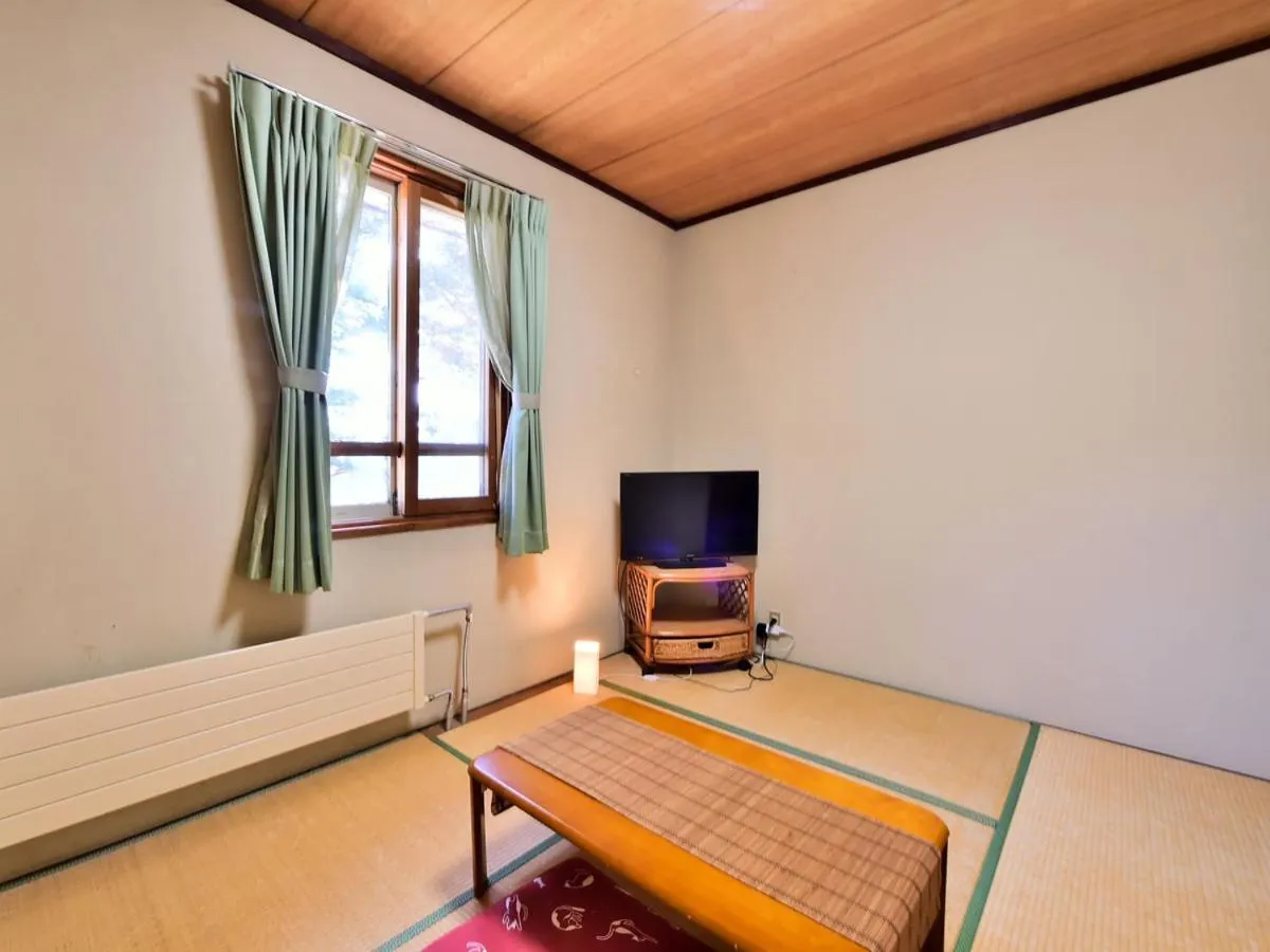 Bed in Kurumayama Kogen Guesthouse Urara