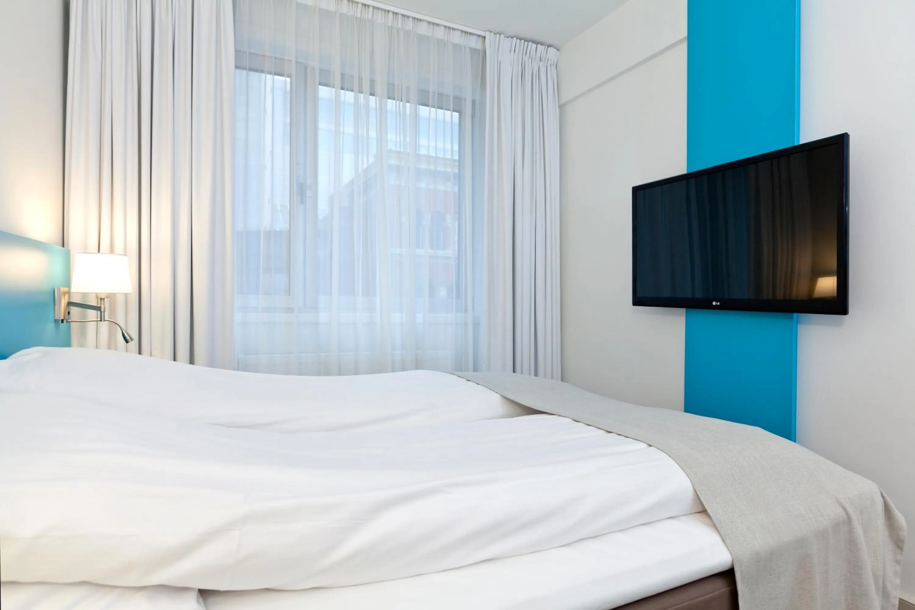 Bed in MediInn Hotel Oslo