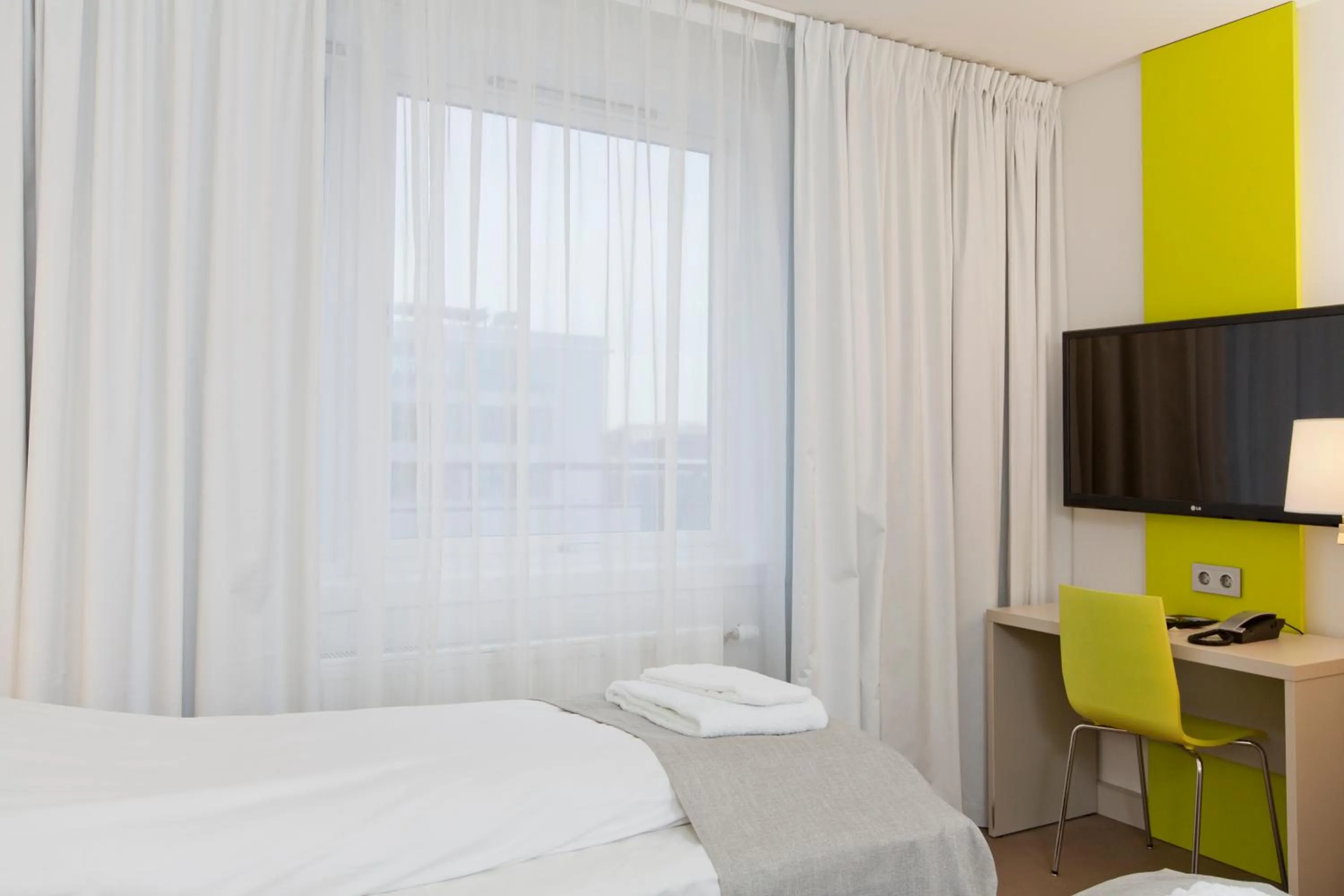 Bed in MediInn Hotel Oslo