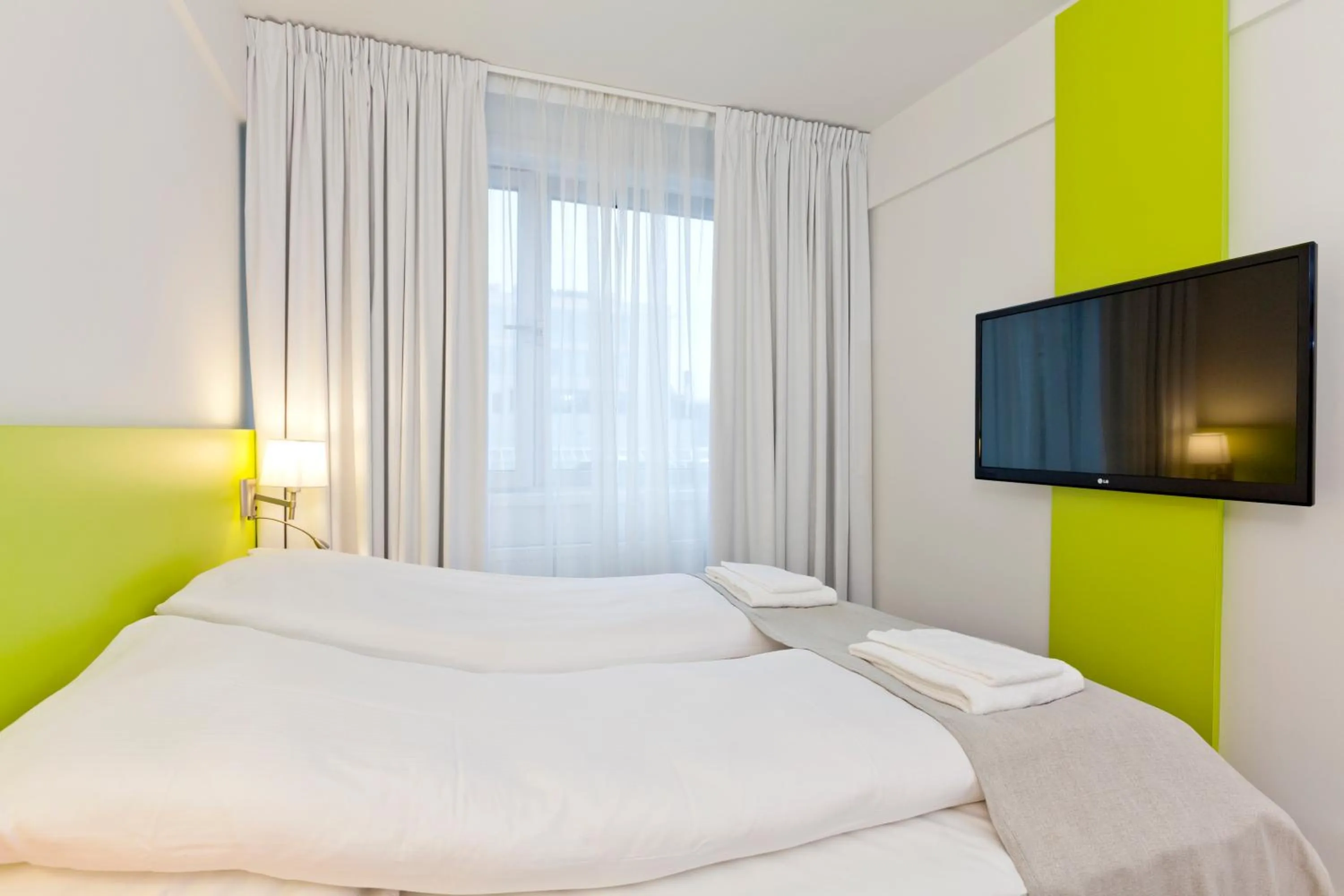 Bed in MediInn Hotel Oslo