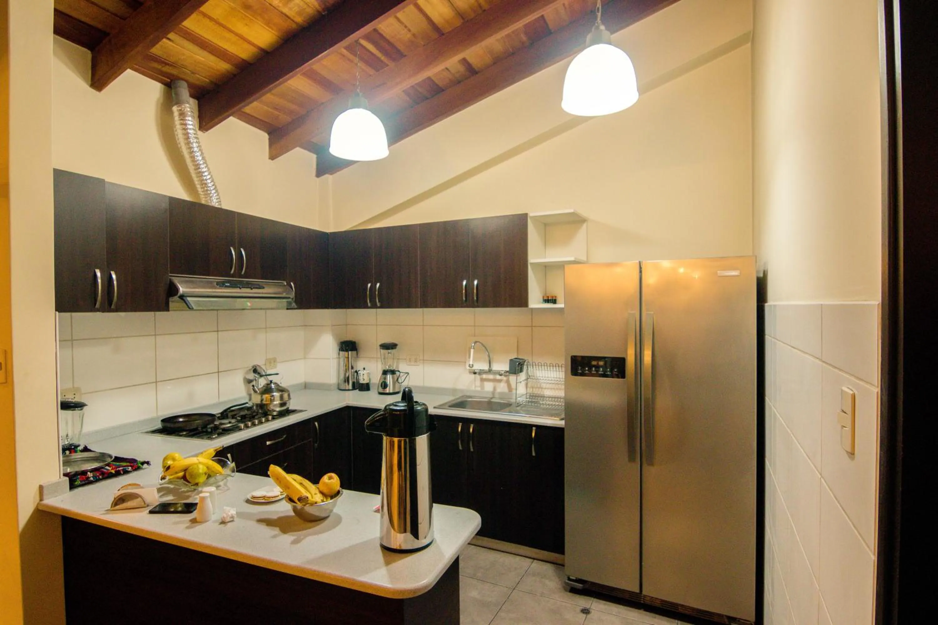 Communal kitchen in Group House Apart Hotel