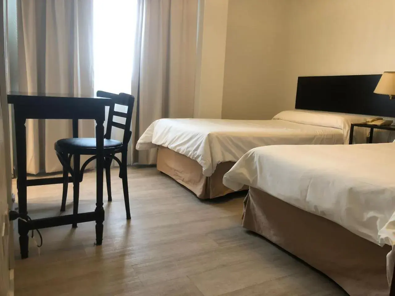 Bed in Hotel La Perla Bed in Hotel La Perla