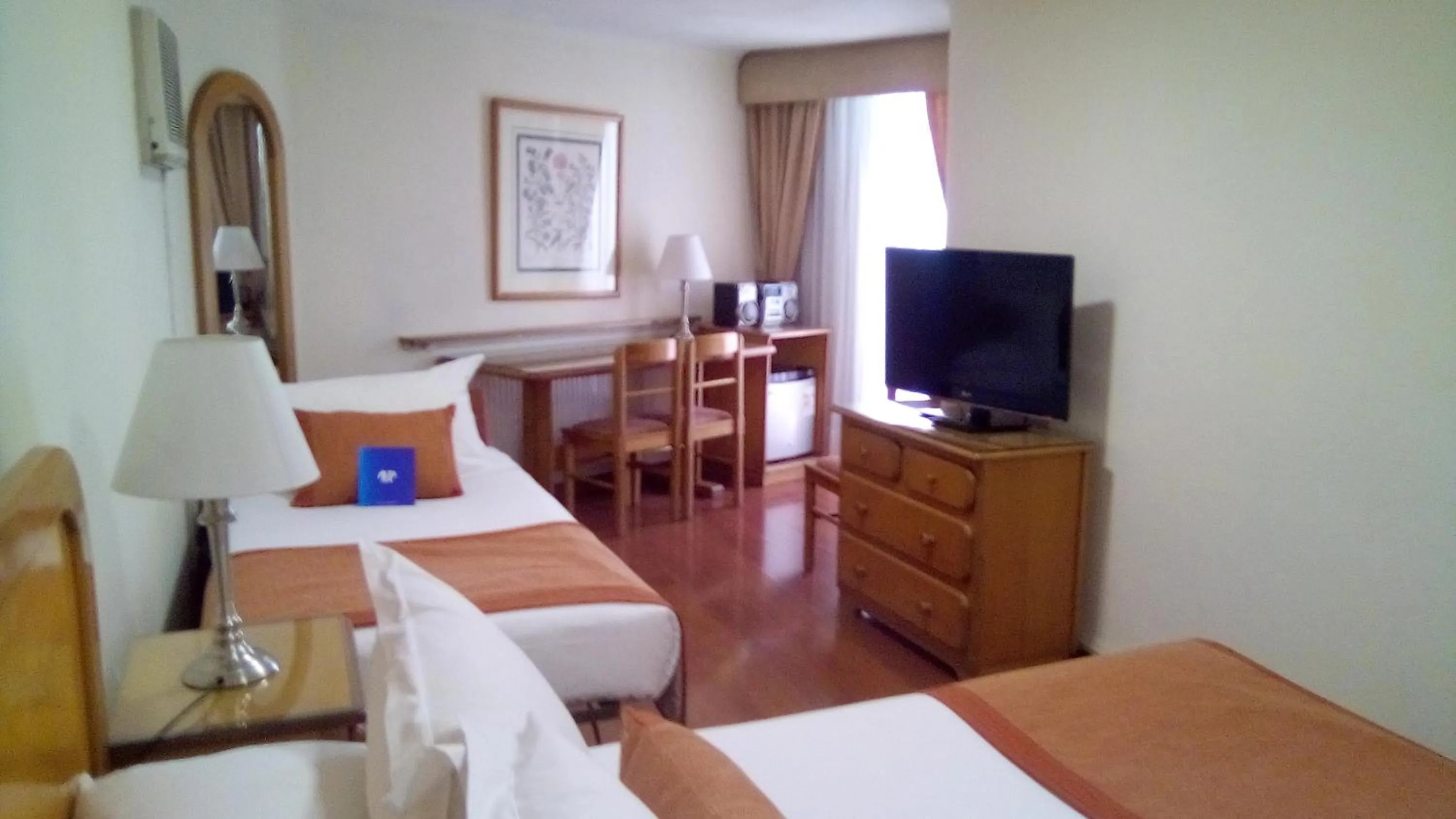 Communal lounge/ TV room, Bed in Hotel Presidente