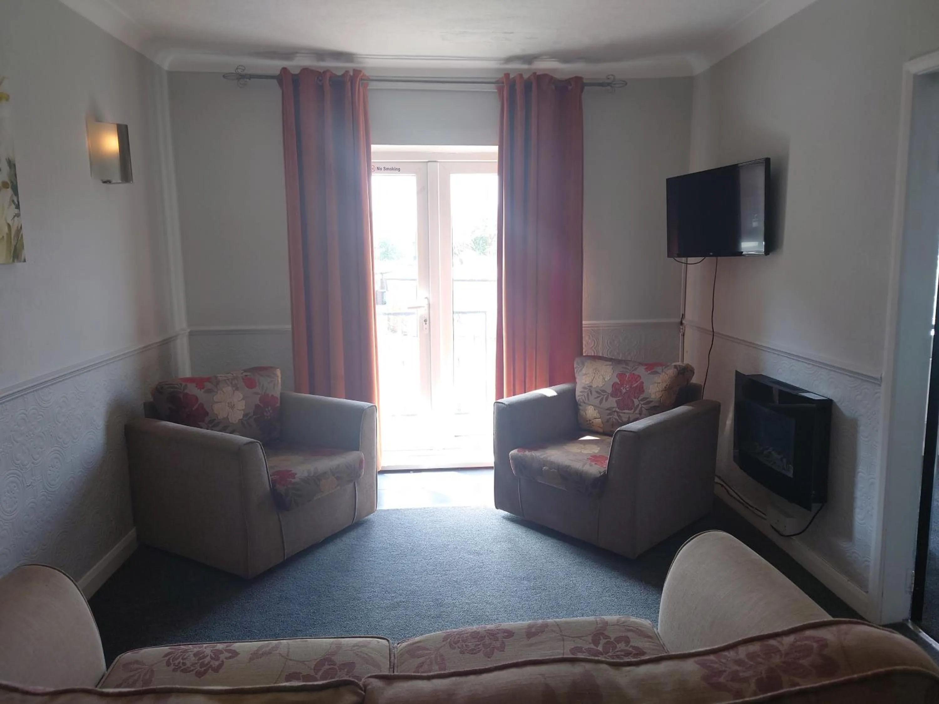 Living room in Coasters Holiday Apartments