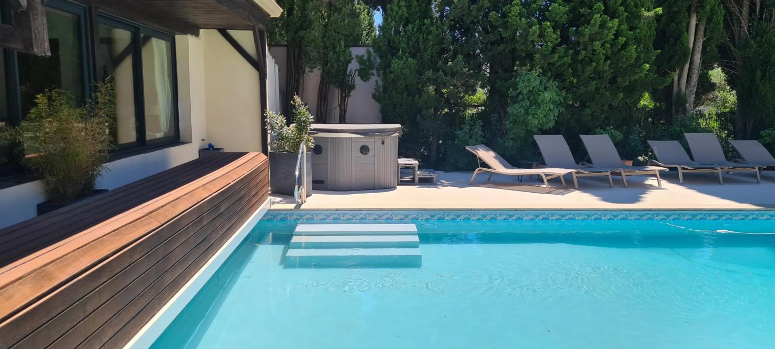 Swimming pool in Logis Hôtel - Restaurant Résidence Les Cèdres