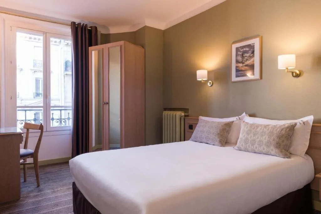 Bed in Paris France Hotel