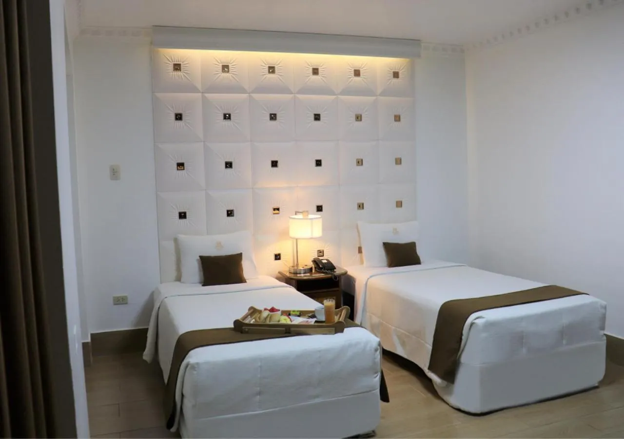 Bed in Inkari Suites Hotel