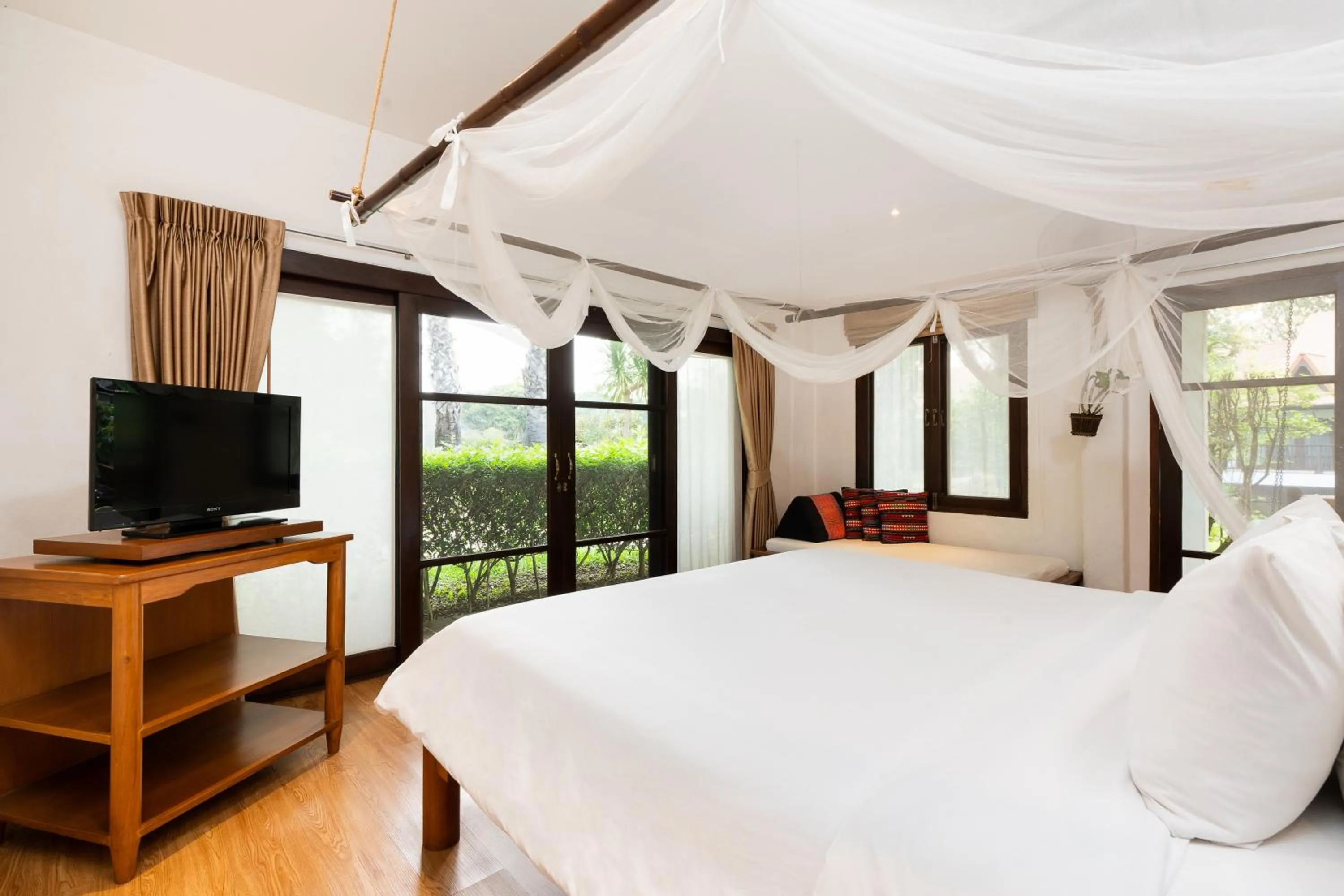 Bed in The Legend Chiang Rai Boutique River Resort & Spa