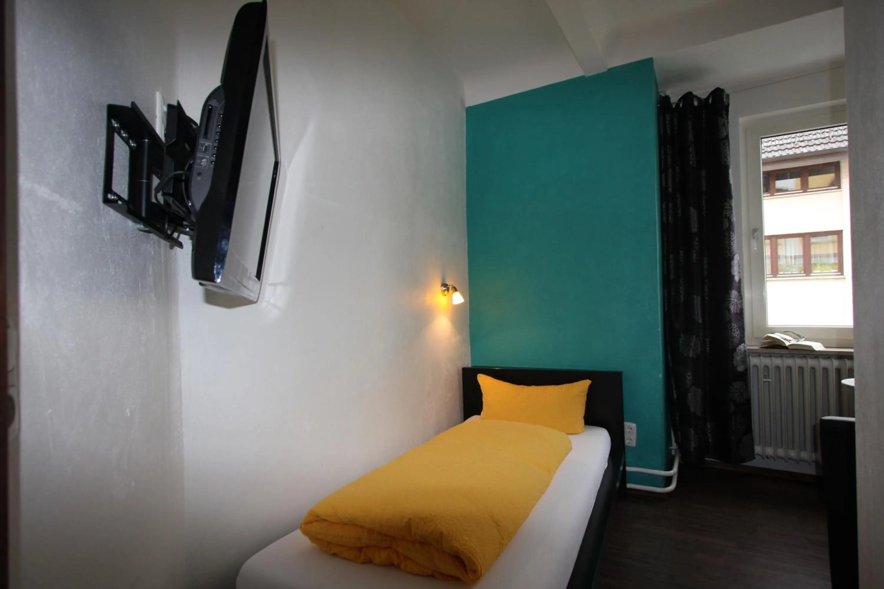 Photo of the whole room, Bed in Stadthotel Kleiner Berg