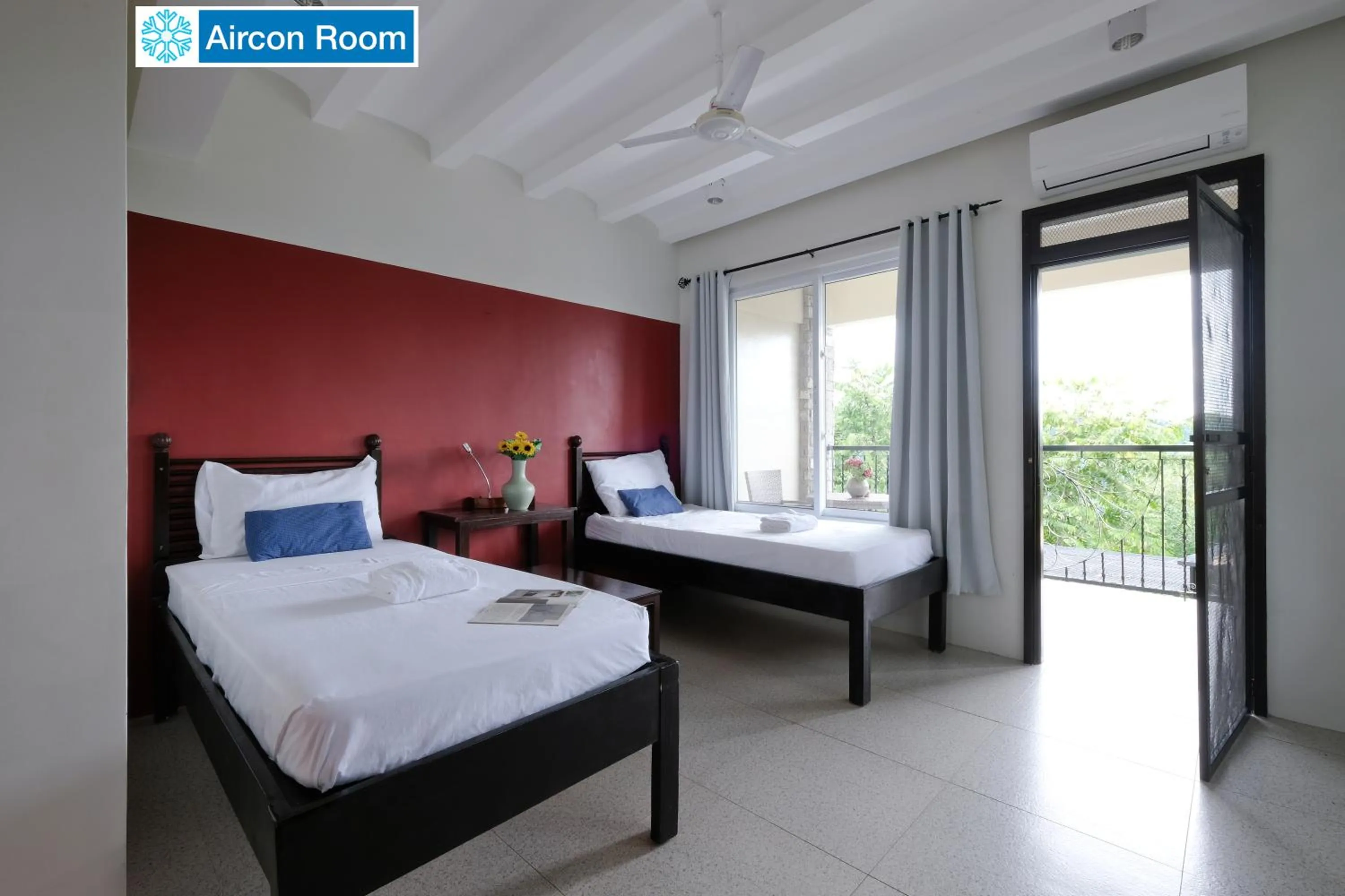 Bed in The Duyan House at Sinagtala Resort