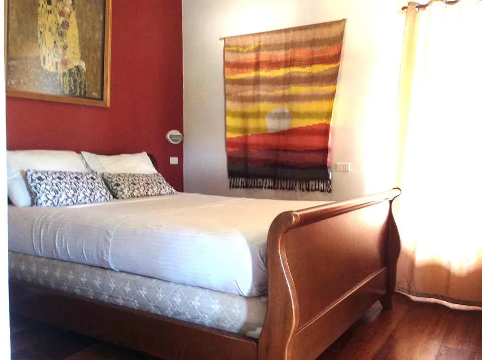 Bed in The Duyan House at Sinagtala Resort