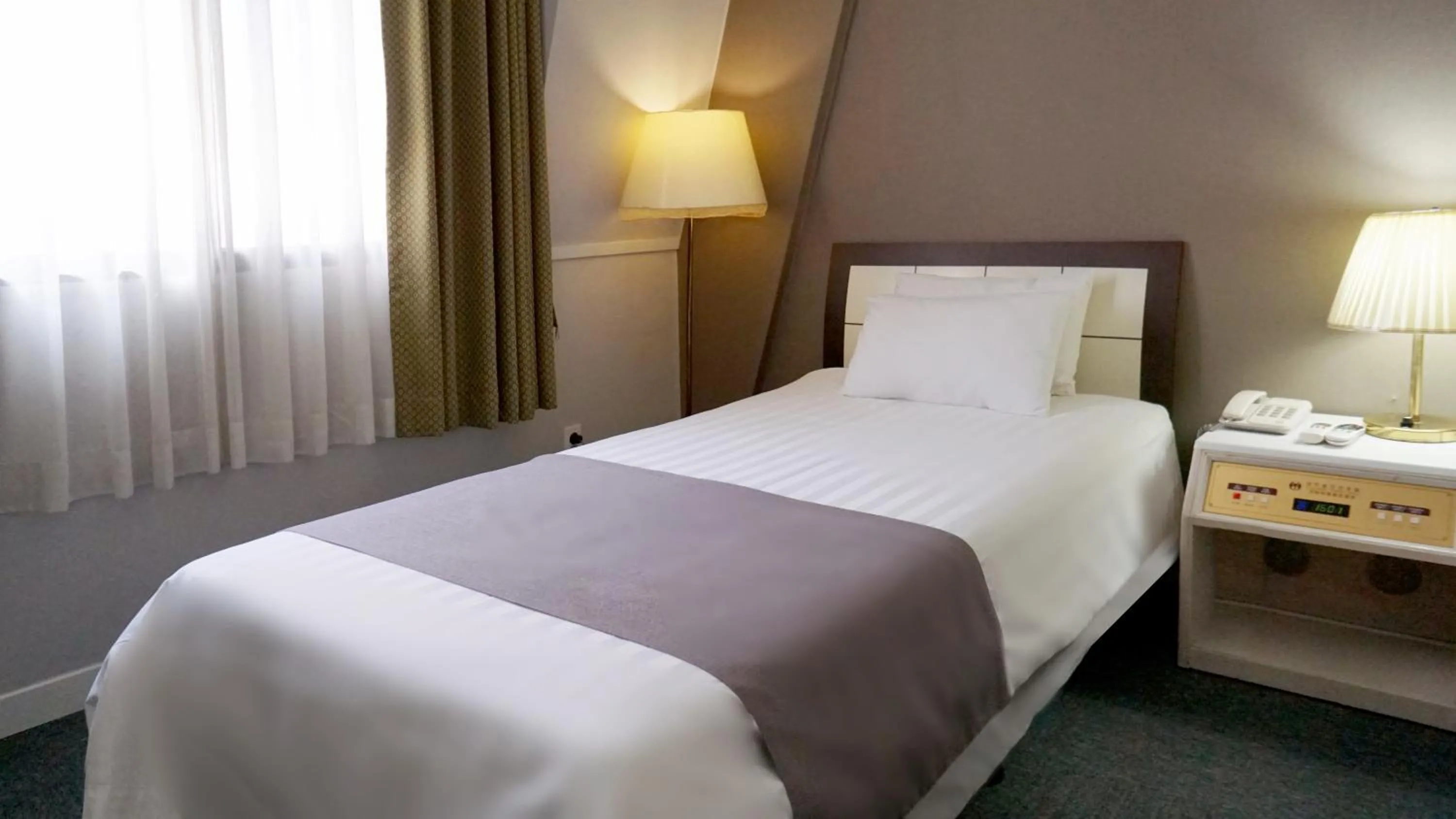 Bed in Pearl Hotel Jeju