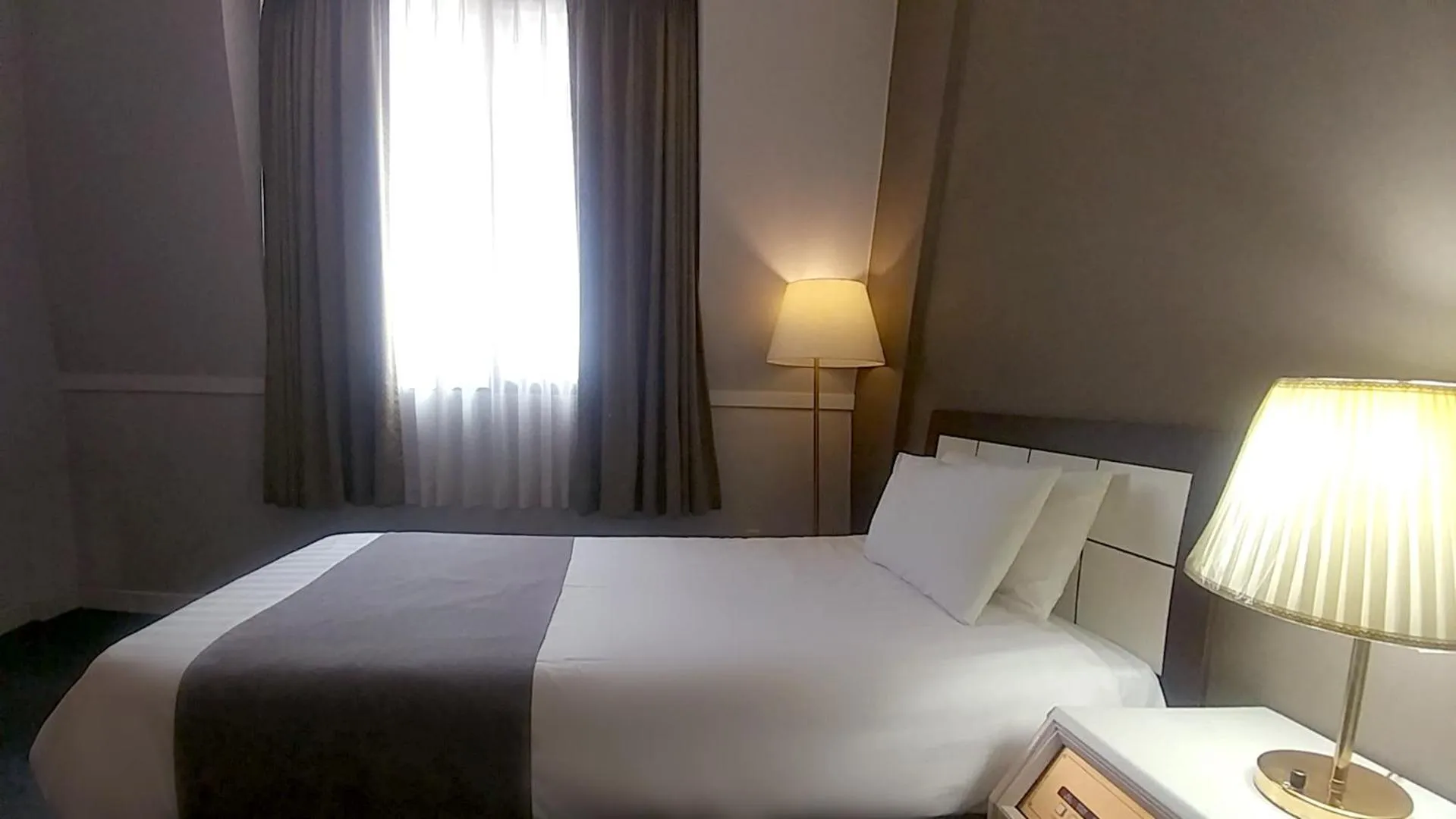 Bed in Pearl Hotel Jeju