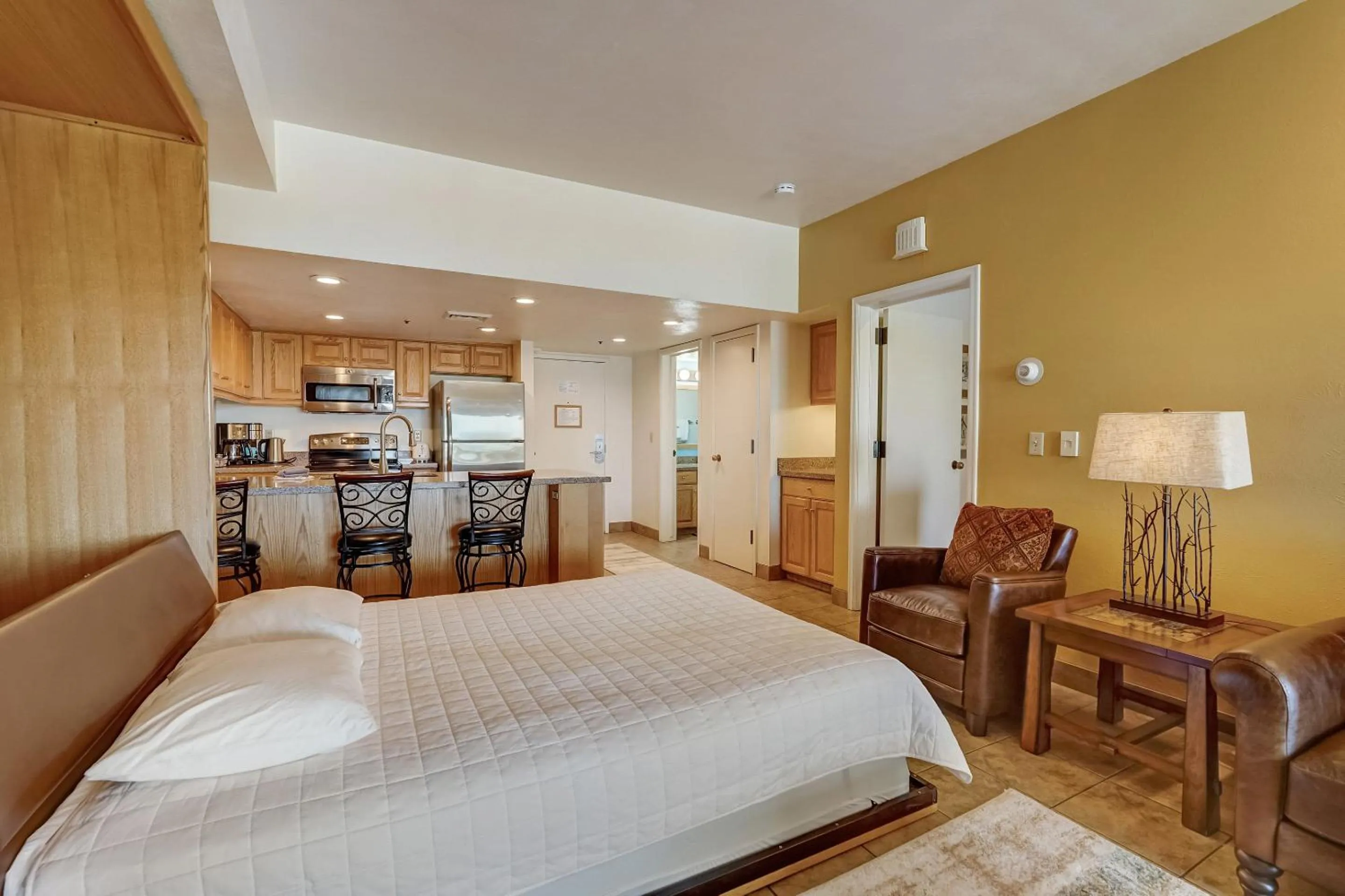 Living room, Bed in The Lodge at the Mountain Village by All Seasons Resort Lodging