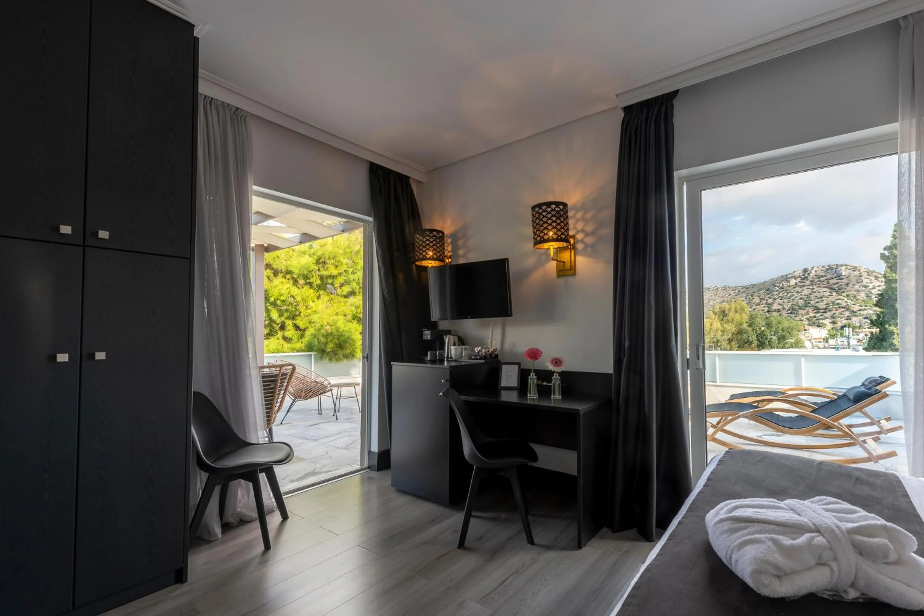 Bed in Athenian Riviera Hotel& Suites