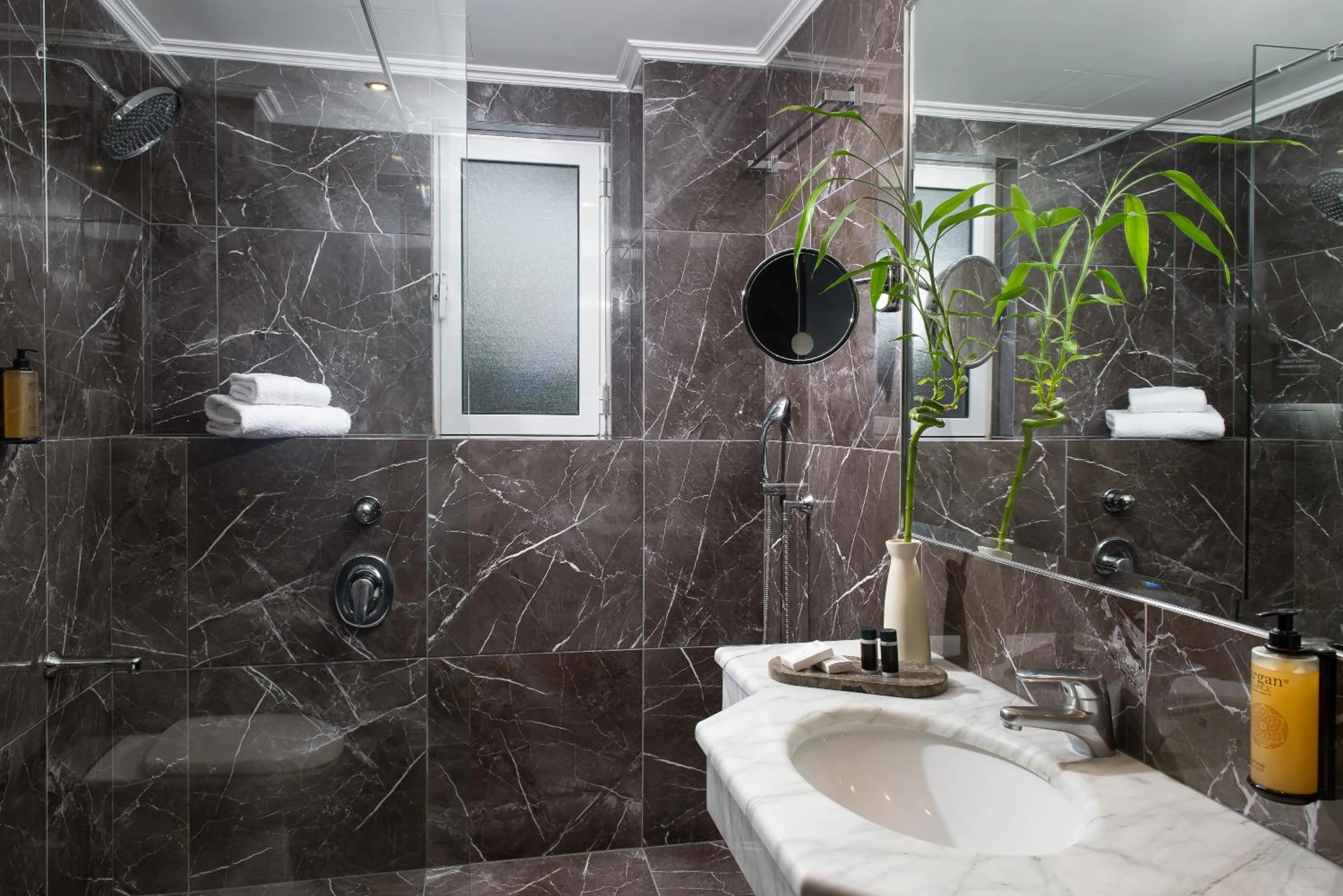 Bathroom in Athenian Riviera Hotel& Suites