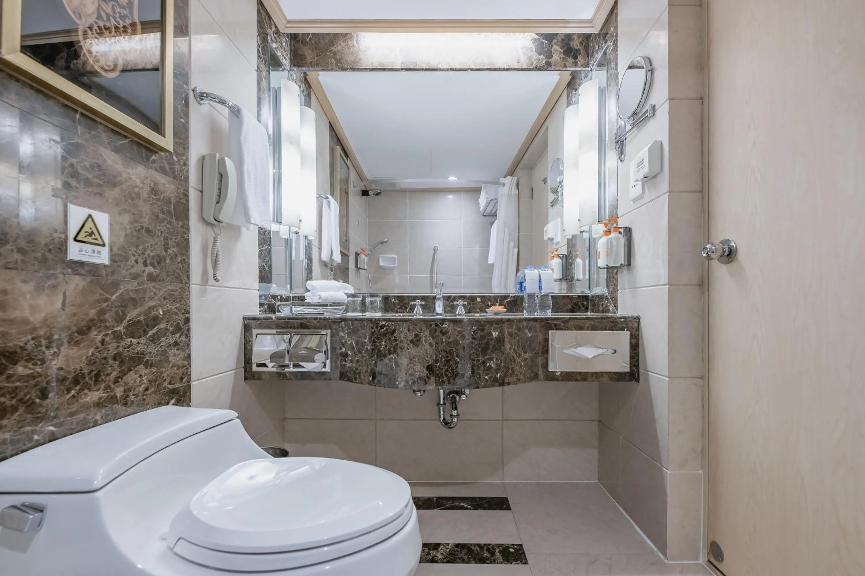 Toilet in Crowne Plaza Shanghai by IHG