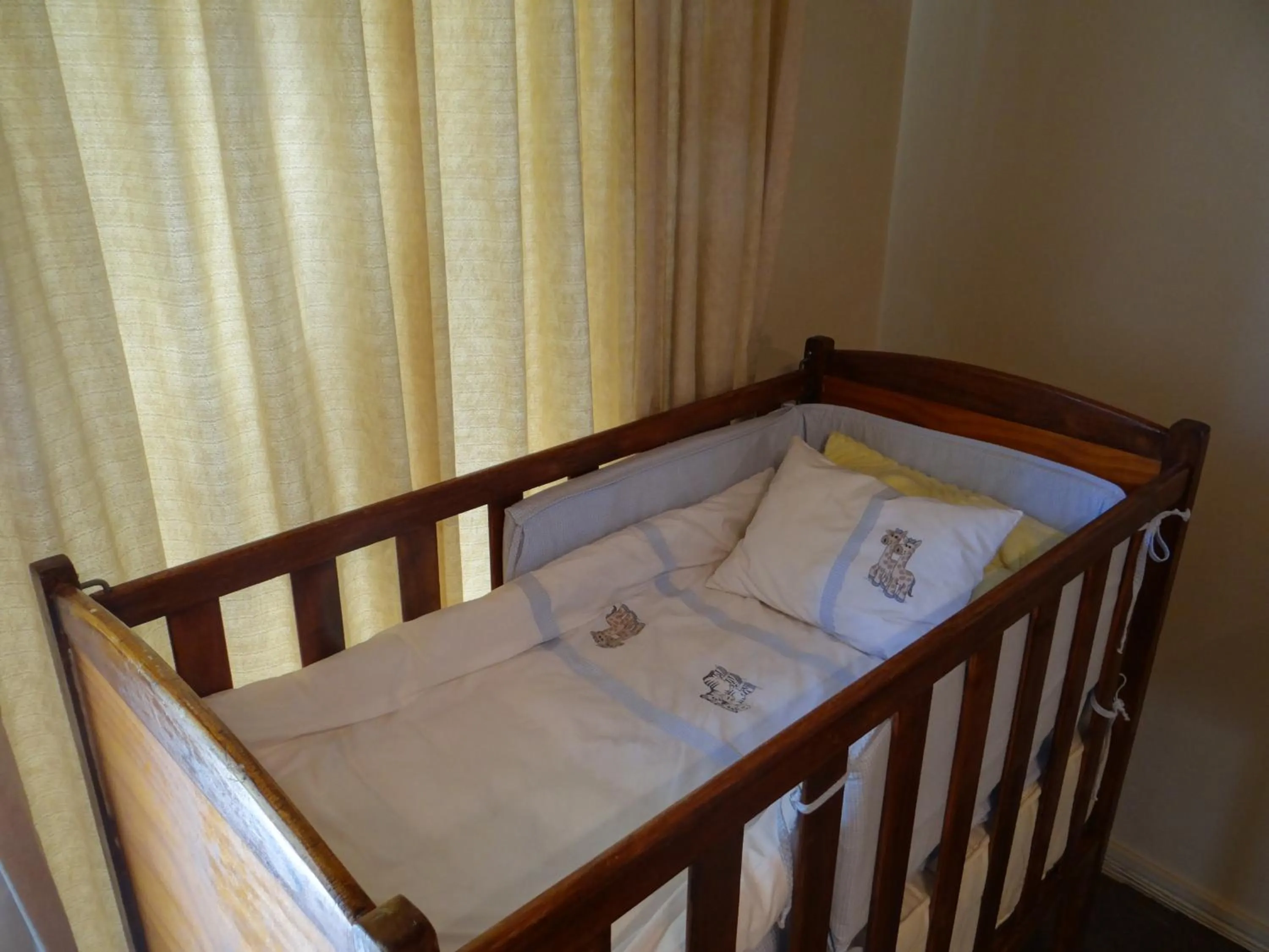 cot, Bed in Agterplaas Guesthouse Pty Ltd