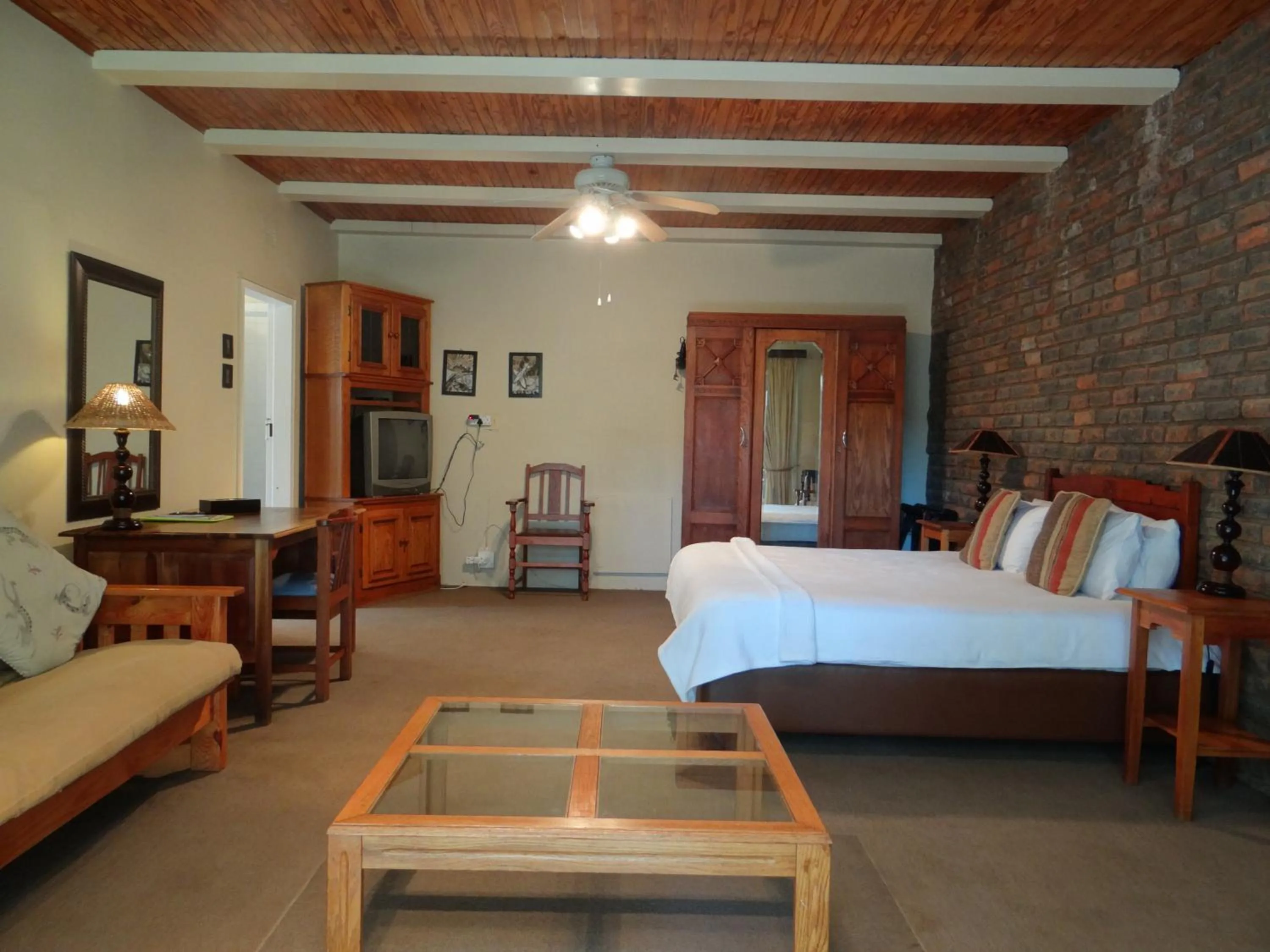 Seating area, Bed in Agterplaas Guesthouse Pty Ltd